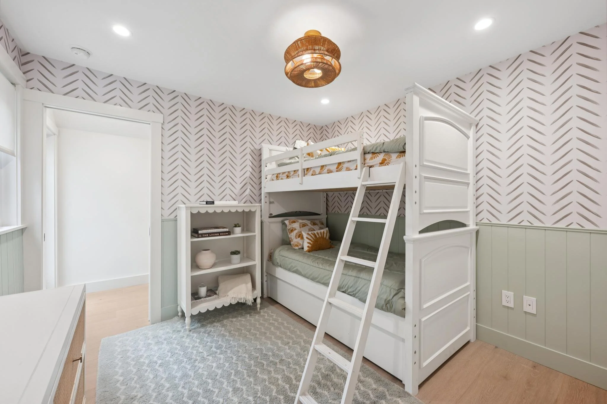 Kids Bedroom renovation in San Anselmo designed by Marin interior designer Studio SQUIRE featuring Patterned Wallpaper, Accent Rug, Scalloped Shelf, and Shiplap.