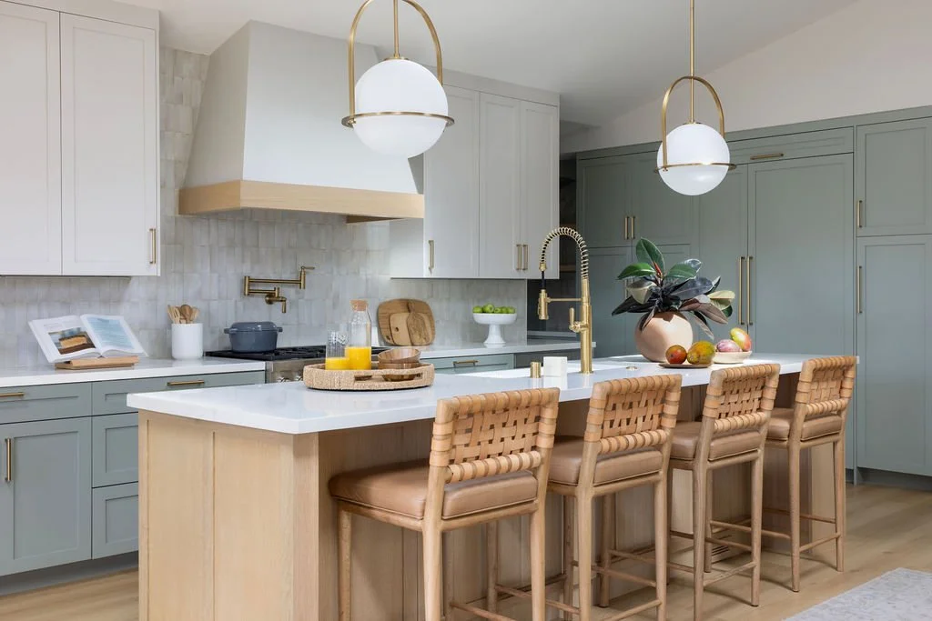Kitchen renovation in Mill Valley designed by Marin interior designer Studio SQUIRE featuring Sage Green Cabinetry, White Oak, Island, Brass Fixtures, and Handcrafted Tile