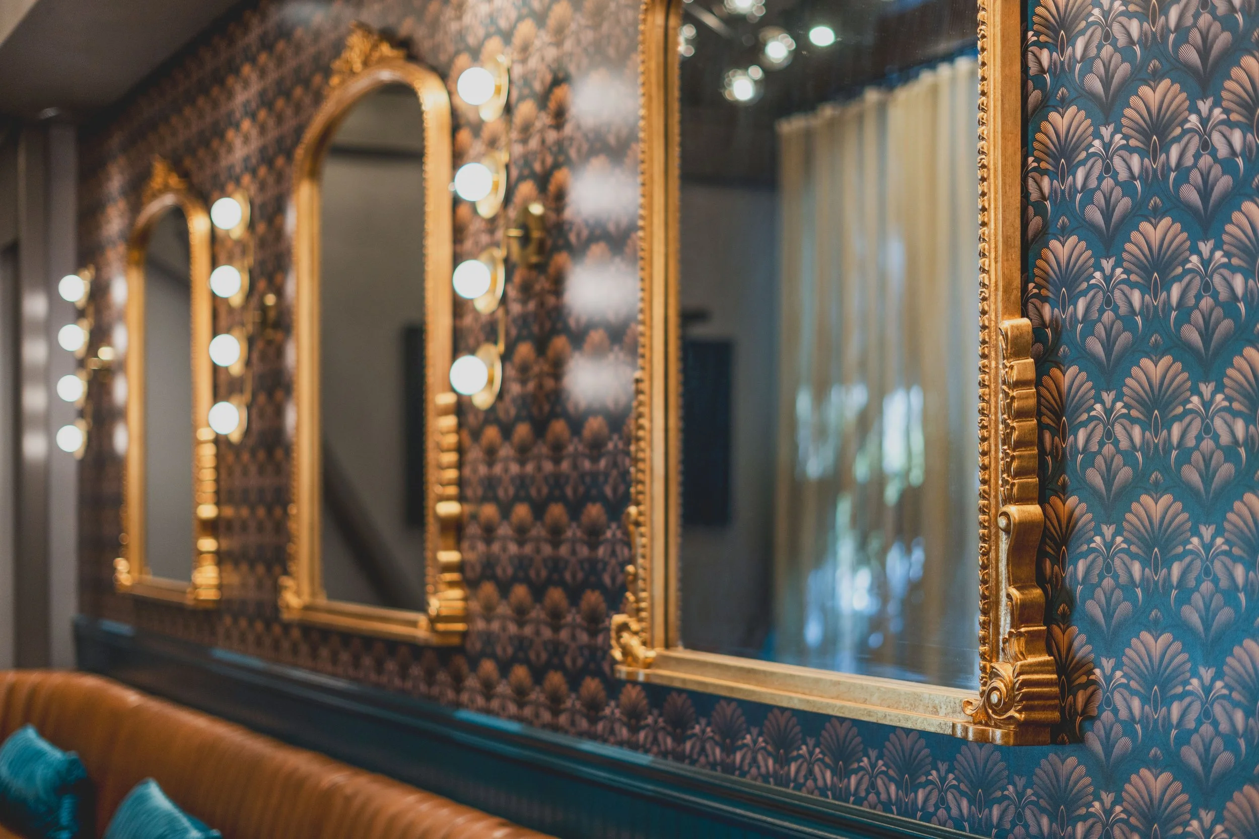 Commercial wine bar renovation in Belvedere-Tiburon designed by Marin interior designer Studio SQUIRE featuring Brass Wall Sconce, Brass Mirrors, and Patterned Wallpaper