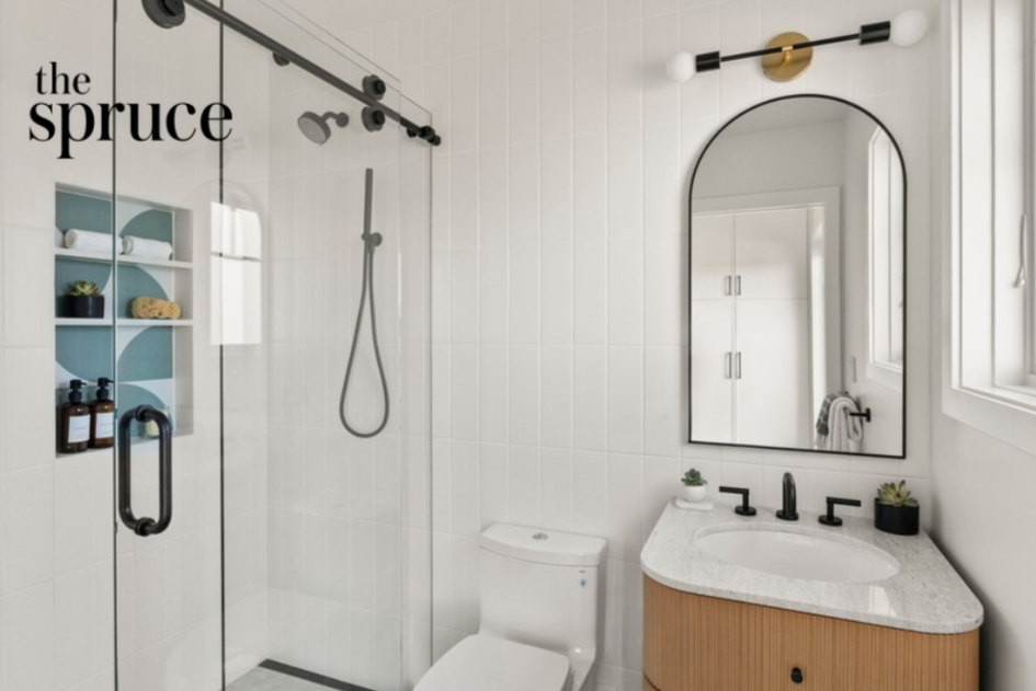 Bathroom renovation in Tiburon designed by Marin interior designer Studio SQUIRE featuring light blue retro tile, white tile, oak vanity, and matte black finishes