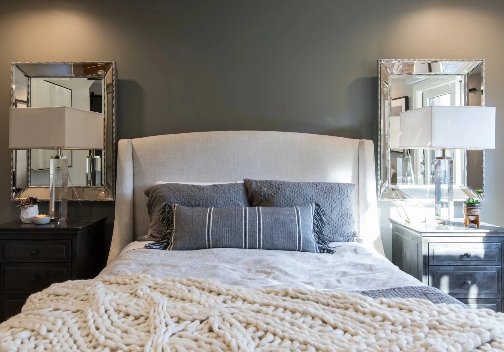 Bedroom renovation designed by Marin interior designer Studio SQUIRE featuring an Upholstered Bed, Throw Pillows, and Nickel features