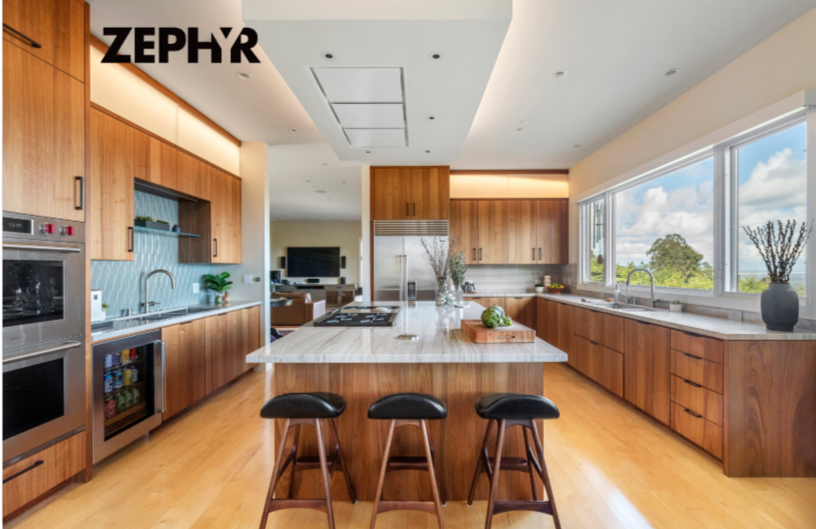 Home renovation in Tiburon designed by Marin interior designer Studio SQUIRE featuring wood cabinets, quartzite countertops, high-end appliances, and counter stools