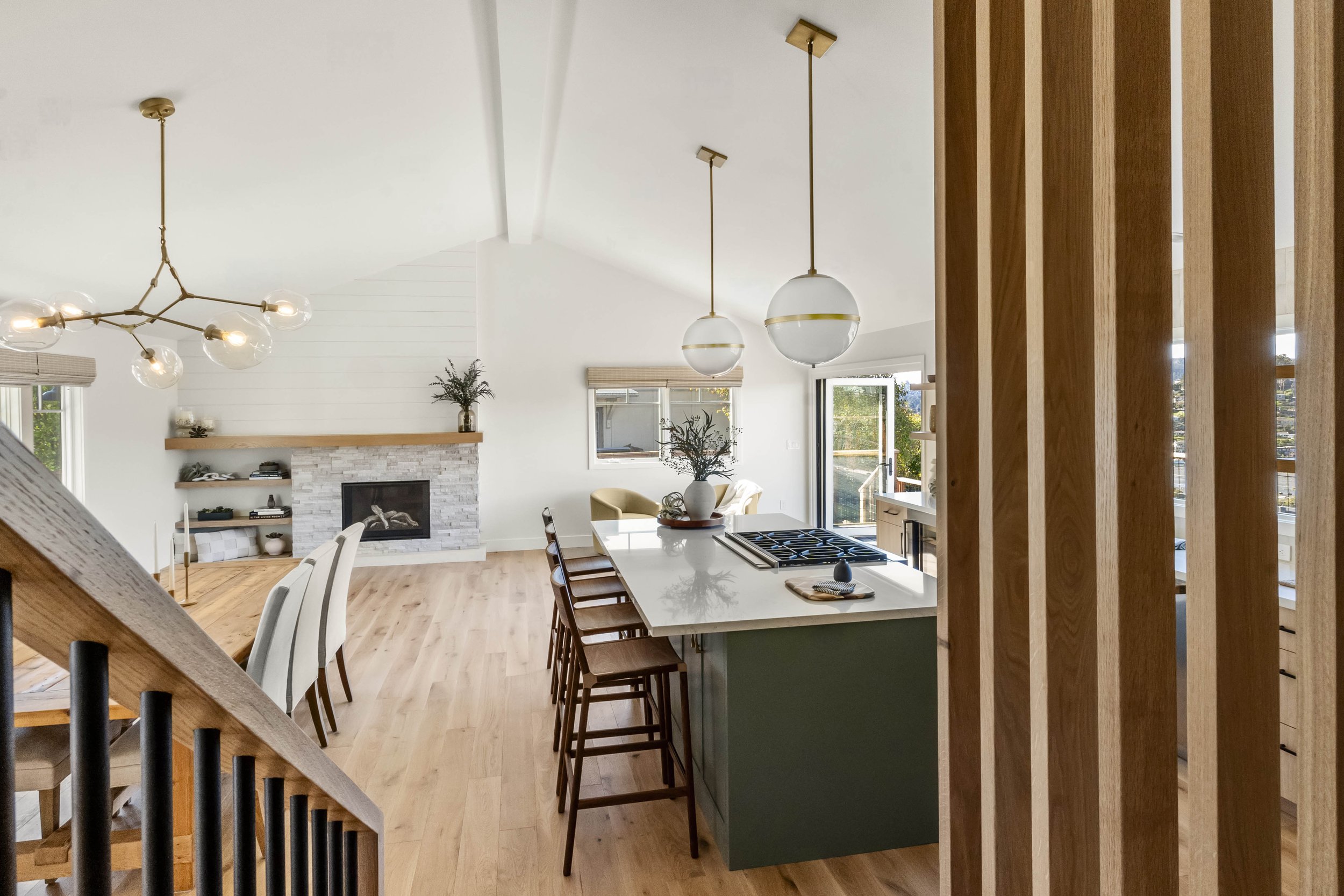 Whole home renovation in Tiburon designed by Marin interior designer Studio SQUIRE featuring open plan living and kitchen area.