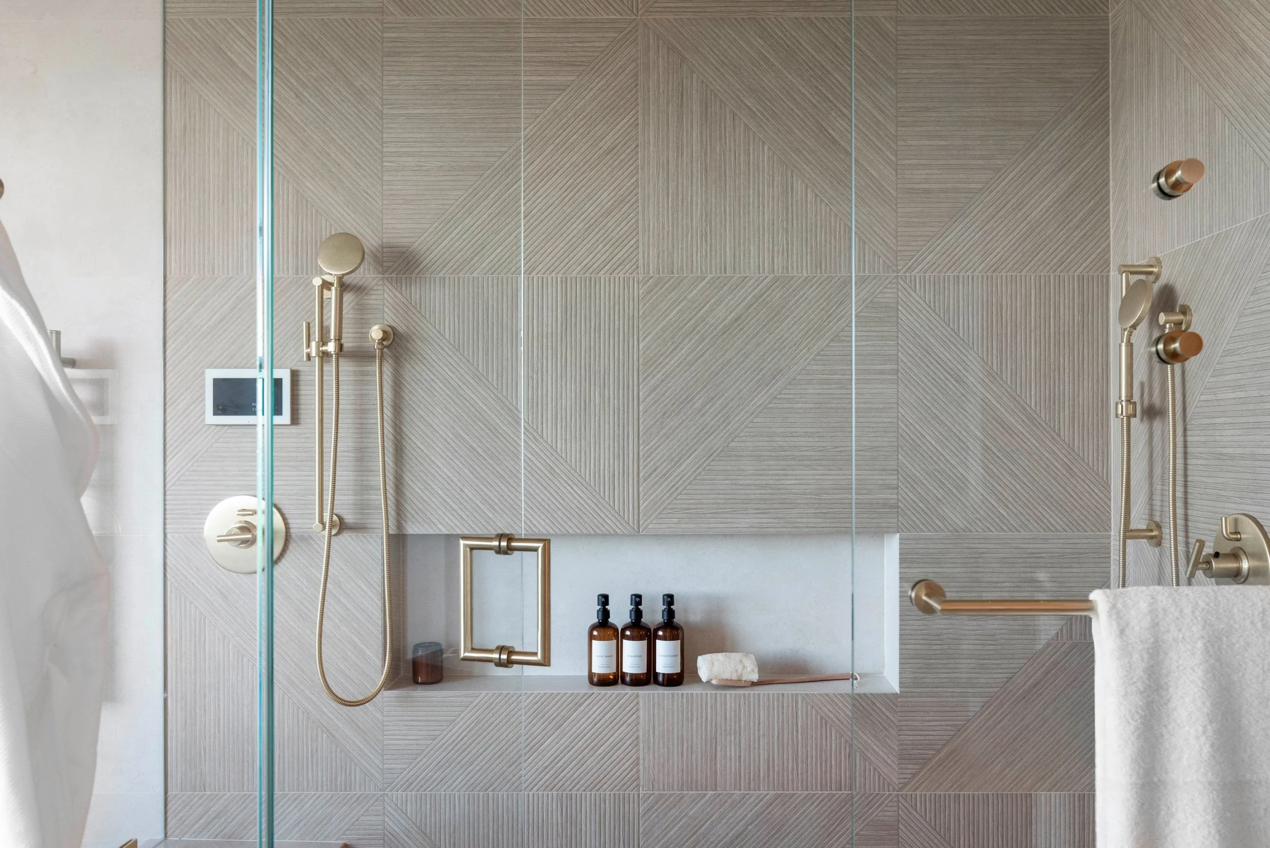 Luxury primary bathroom renovation in Tiburon designed by Marin interior designer Studio SQUIRE featuring a coastal modern custom steam shower design.