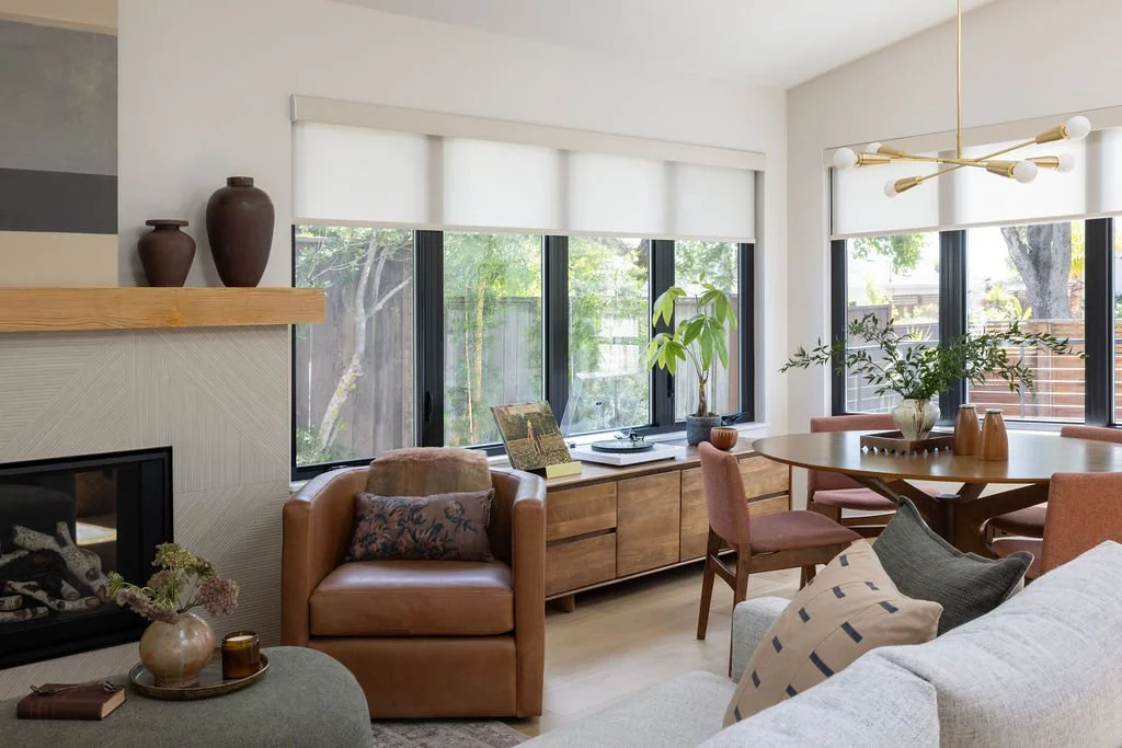 Living and Dining Room renovation in Mill Valley designed by Marin interior designer Studio SQUIRE featuring Custom Fireplace and Brass Light Fixture