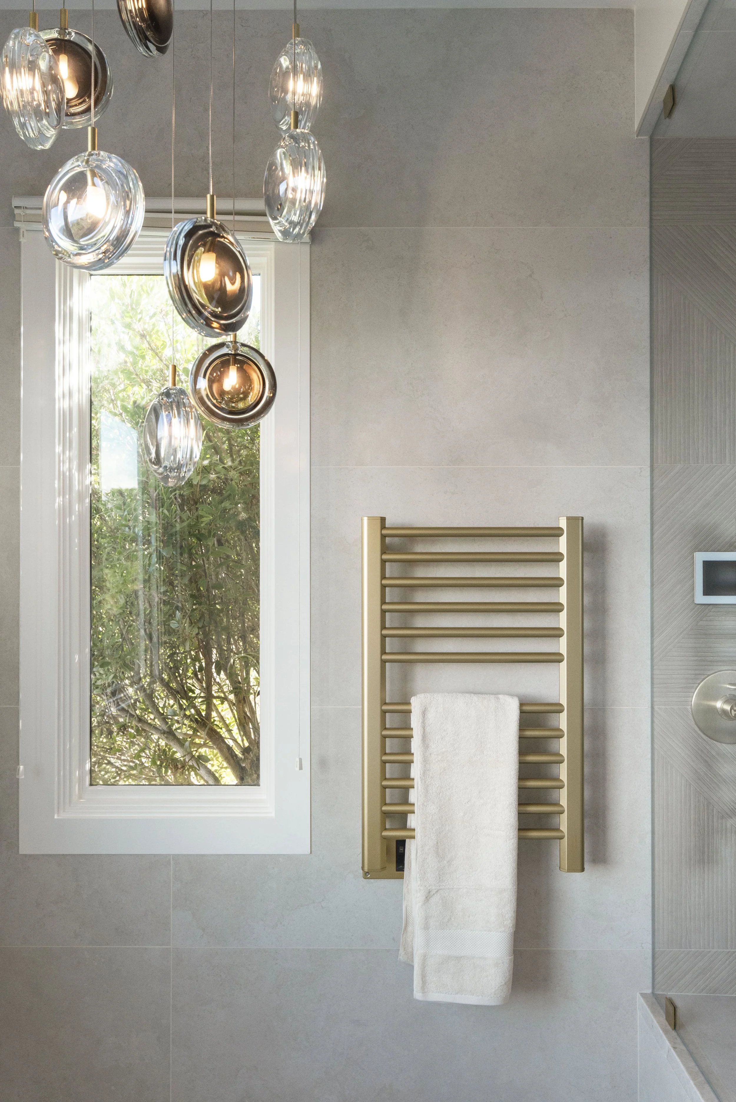 Studio Squire | SF Bay Area | Marin County | Tiburon Luxury Primary Bathroom Renovation | Towel warmer and chandelier