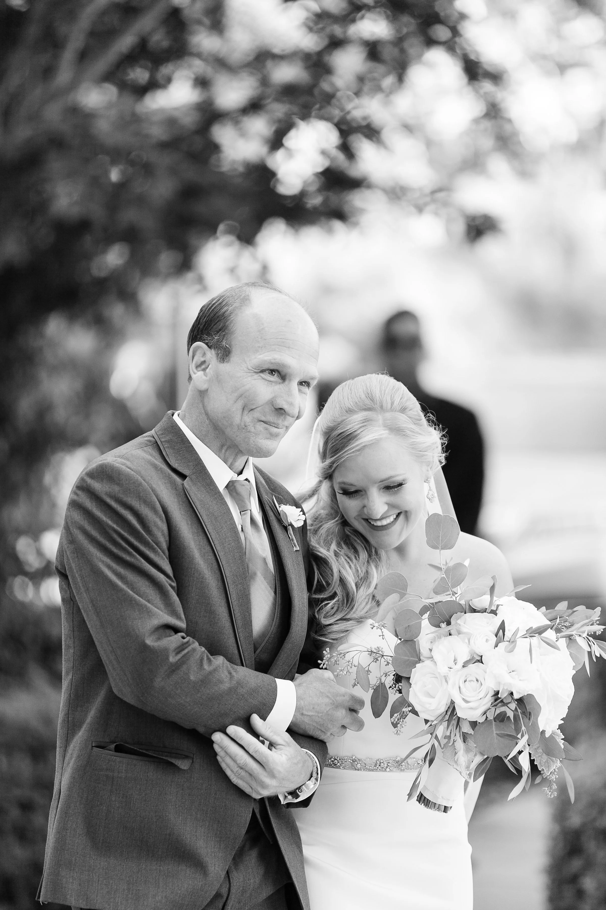 bride walking down the aisle with her father
