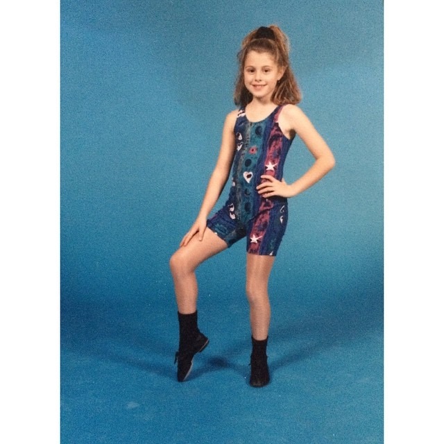 This was from my first ever dance recital. We danced to "ABC" by the Jackson 5. I was eight years old and absolutely fell in love with being on stage and performing for an audience. I danced for ten years and miss it all the time. Luckily, the costumes and my personal style progressed a bit over the years. My favorite thing about this picture is my toasty, golden thighs. 