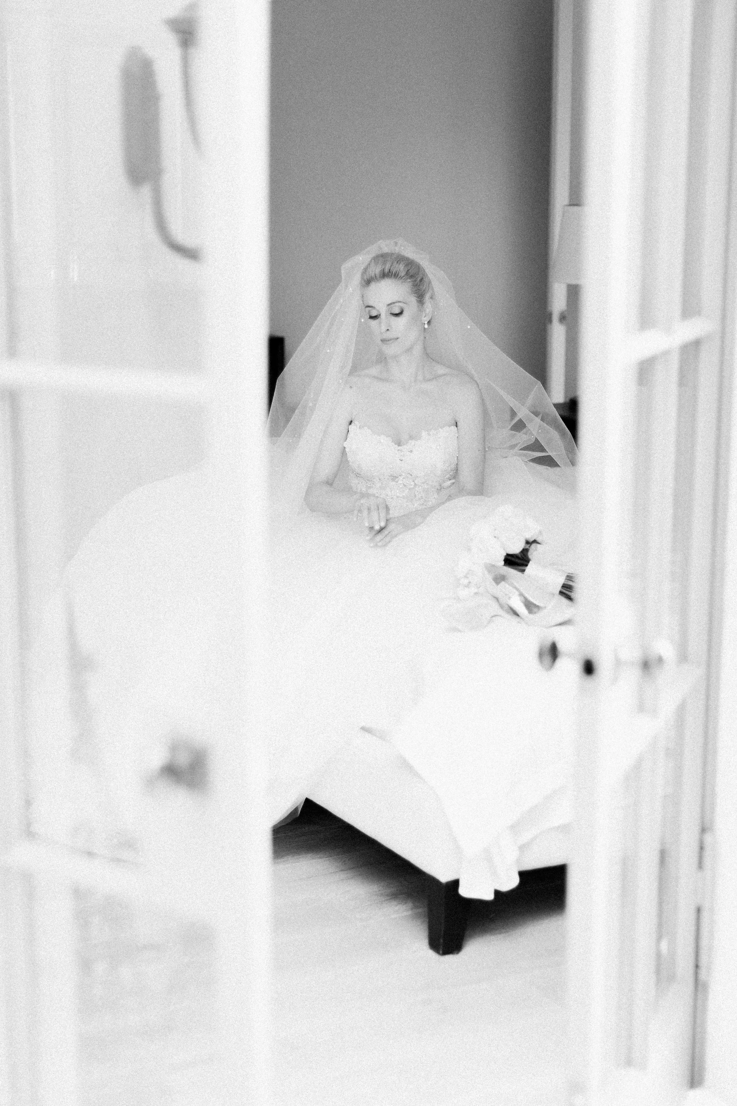 Black and white portrait of a bride getting ready
