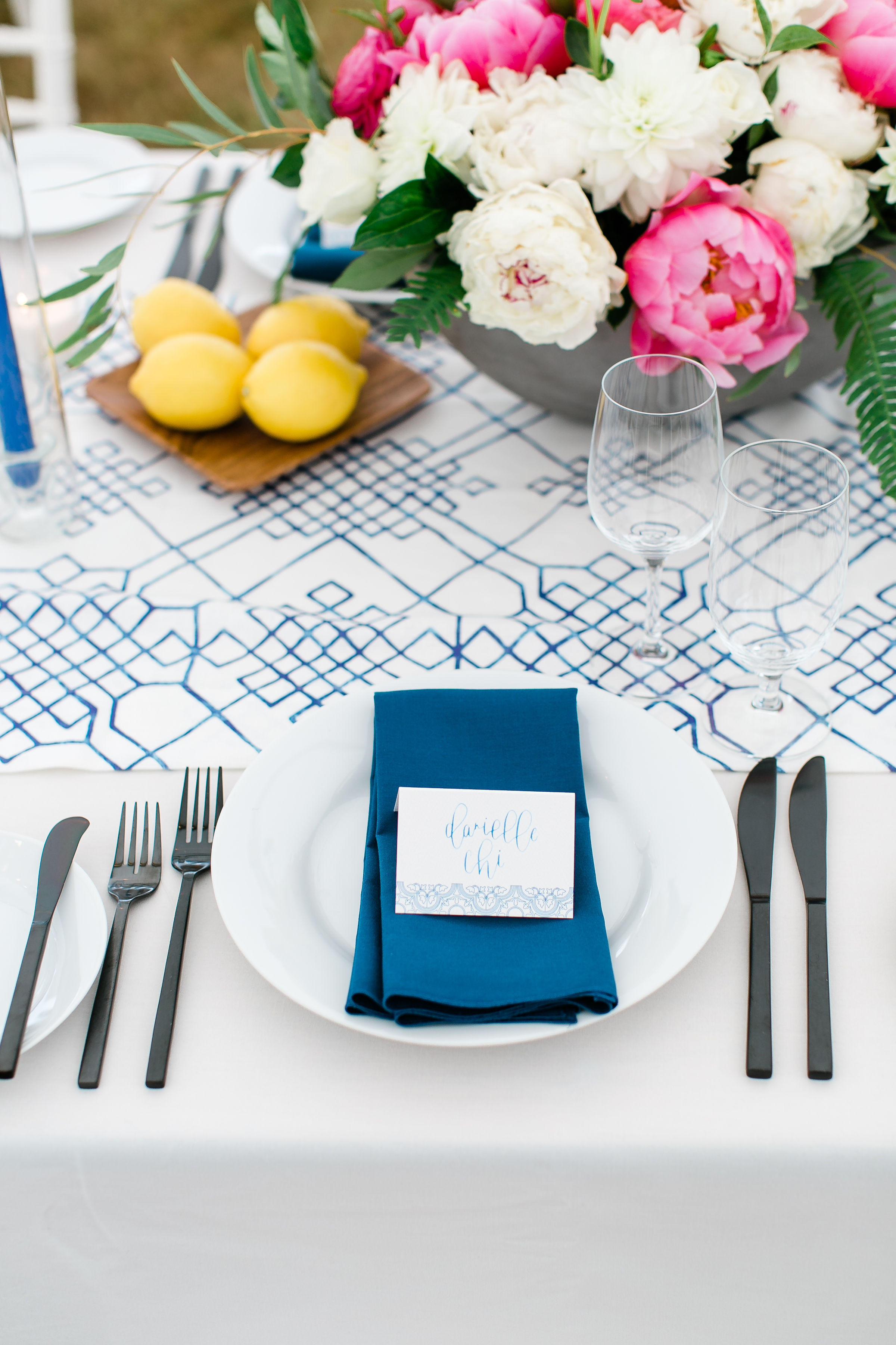 Lemons and pink peonies decorate the wedding table