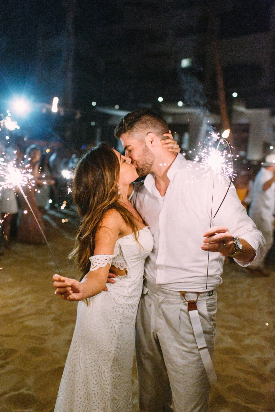Mexico wedding sparkler exit kissing