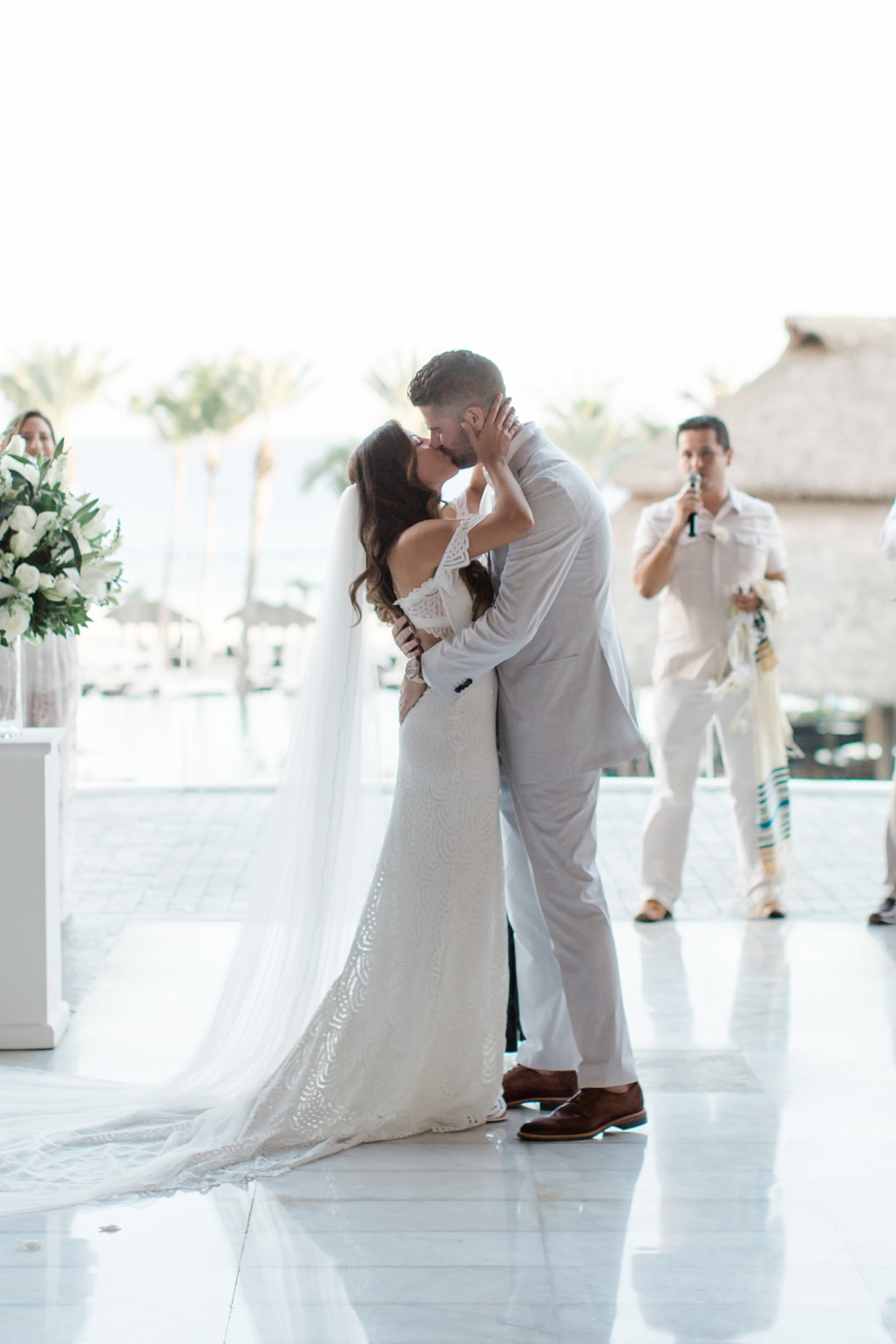 bride and groom first kiss