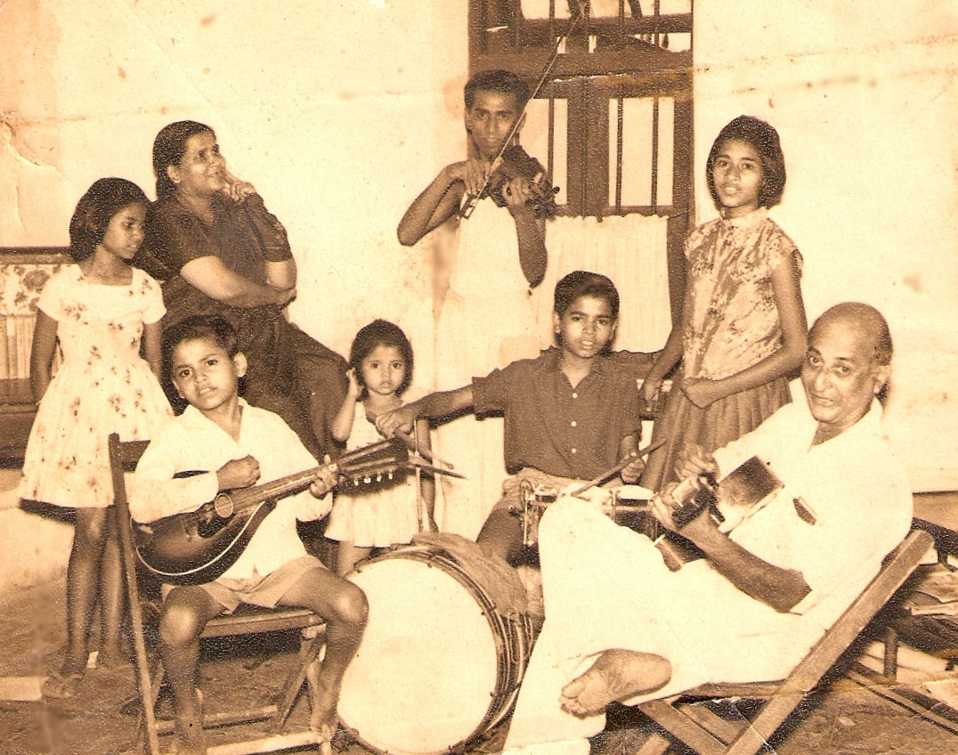 Young Ivan Arthur on the violin. His father is playing the guitar while his brothers play various other instruments and the women join in the singing. Courtesy Ivan Arthur.
