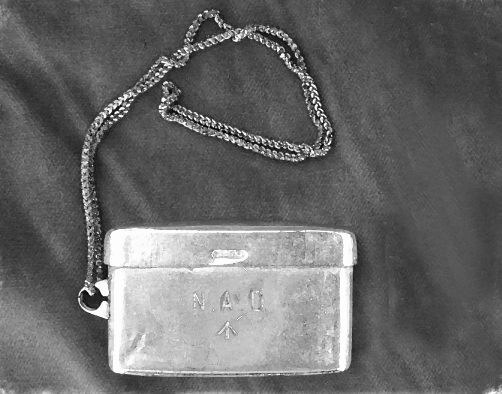 The metal box Africans were required to wear around their necks under the system of kipande.