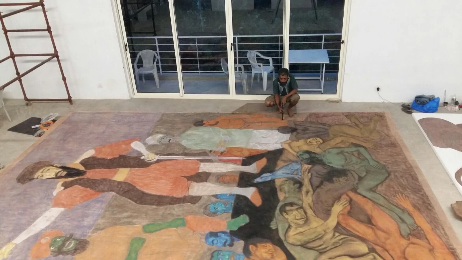 Viraj Naik at work on the Painting of The Triumphant Trio (2015).
