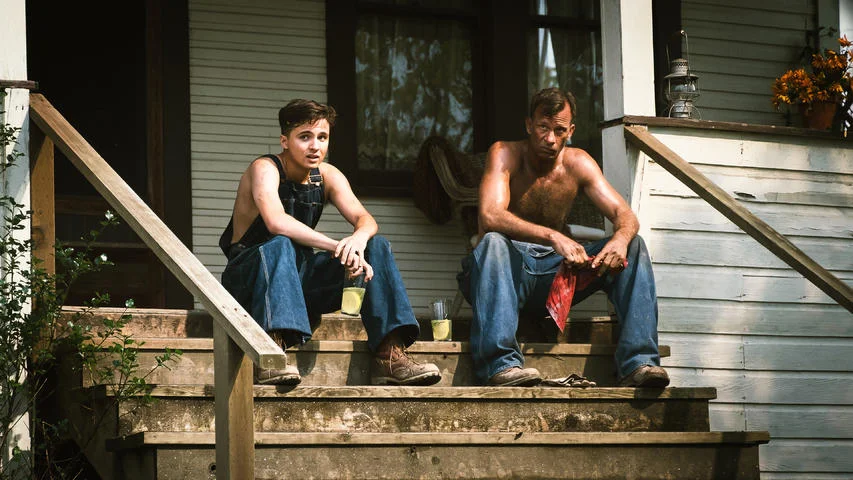 Henry learns everything he needs to know from Wilf, whether Wilf likes it or not. Father and son stare out from the porch on a work break.