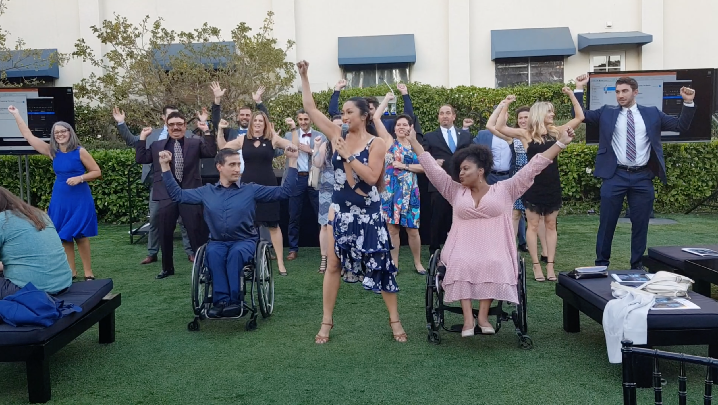 Marisa leads a group of lawyers to dance at the Disability Rights Legal Center Gala