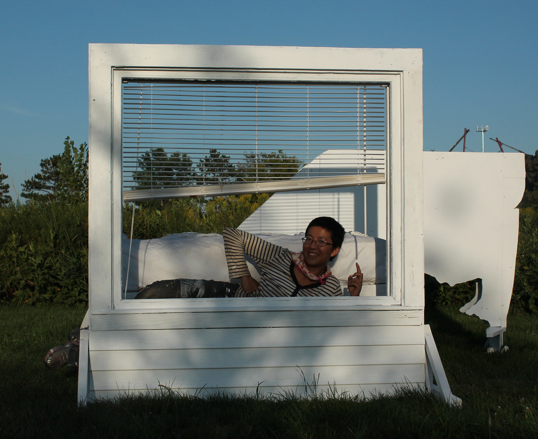Smiling on the newly finished work, A Day of Light in Exile, at Franconia Sculpture Park, MN, 2012