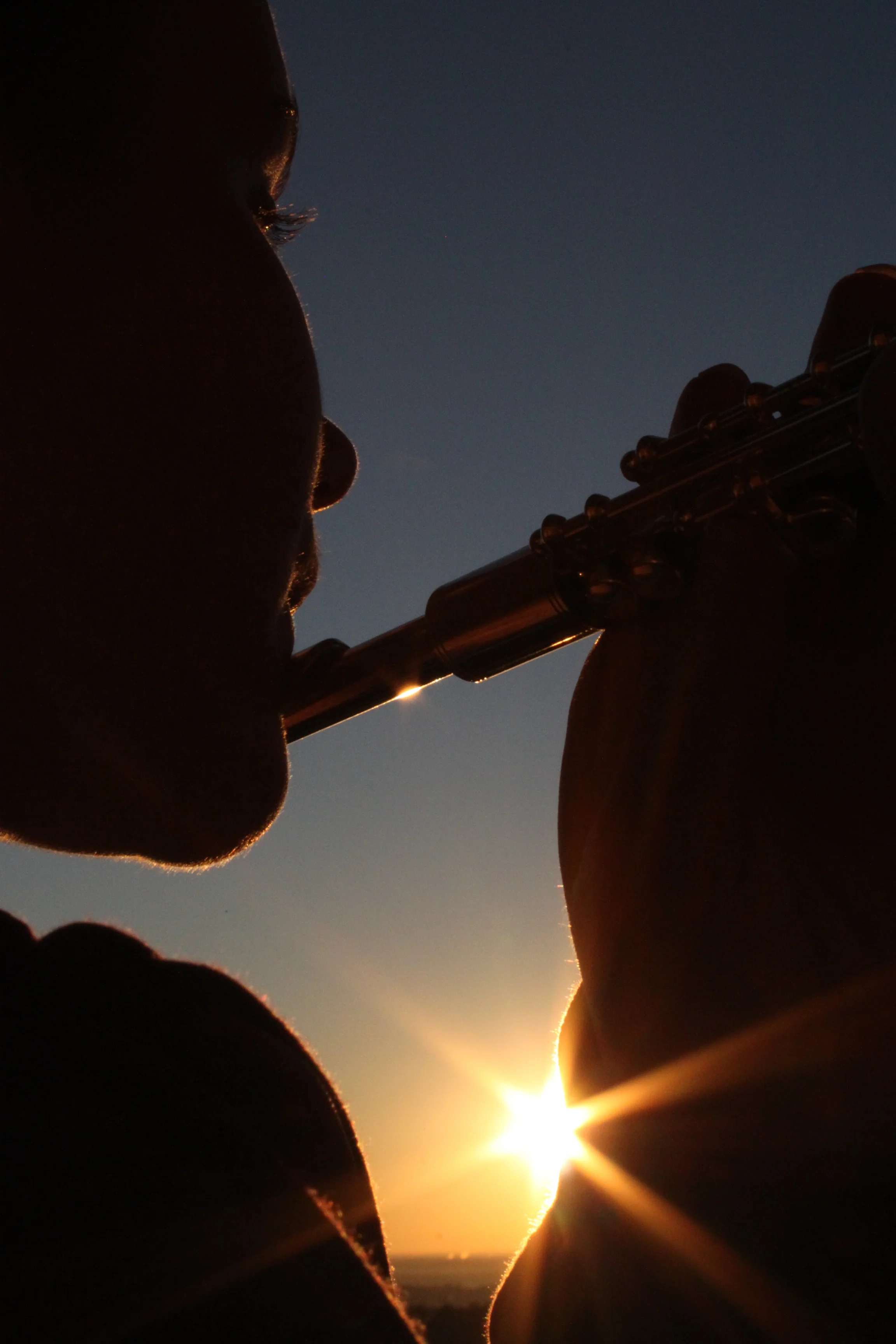 Chrissy, an 18-year-old freshman, practices the flute at sunrise for The University of North Carolina's band in Chapel Hill.&nbsp; 