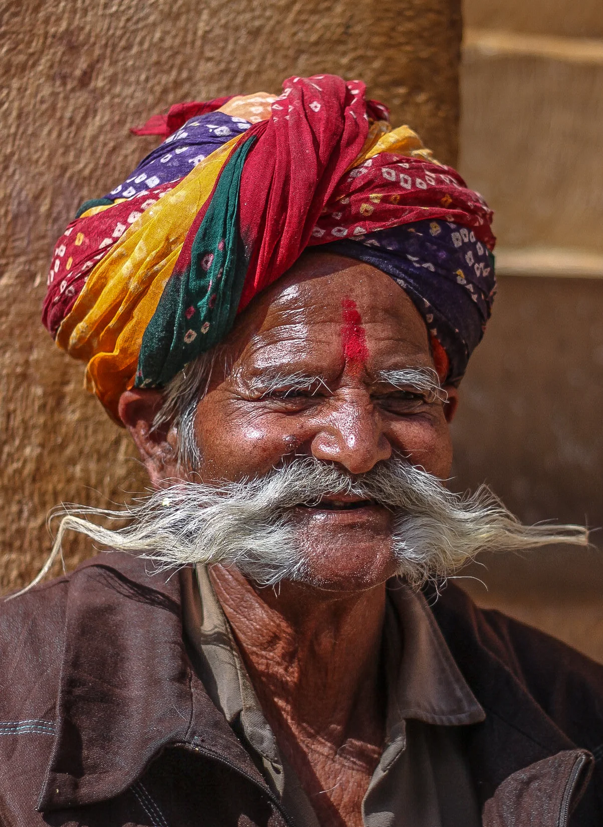  Tulsi Das displays his mustache that is long enough to go behind his ears. It took, he said, 5-6 years to grow his mustache to this length. 