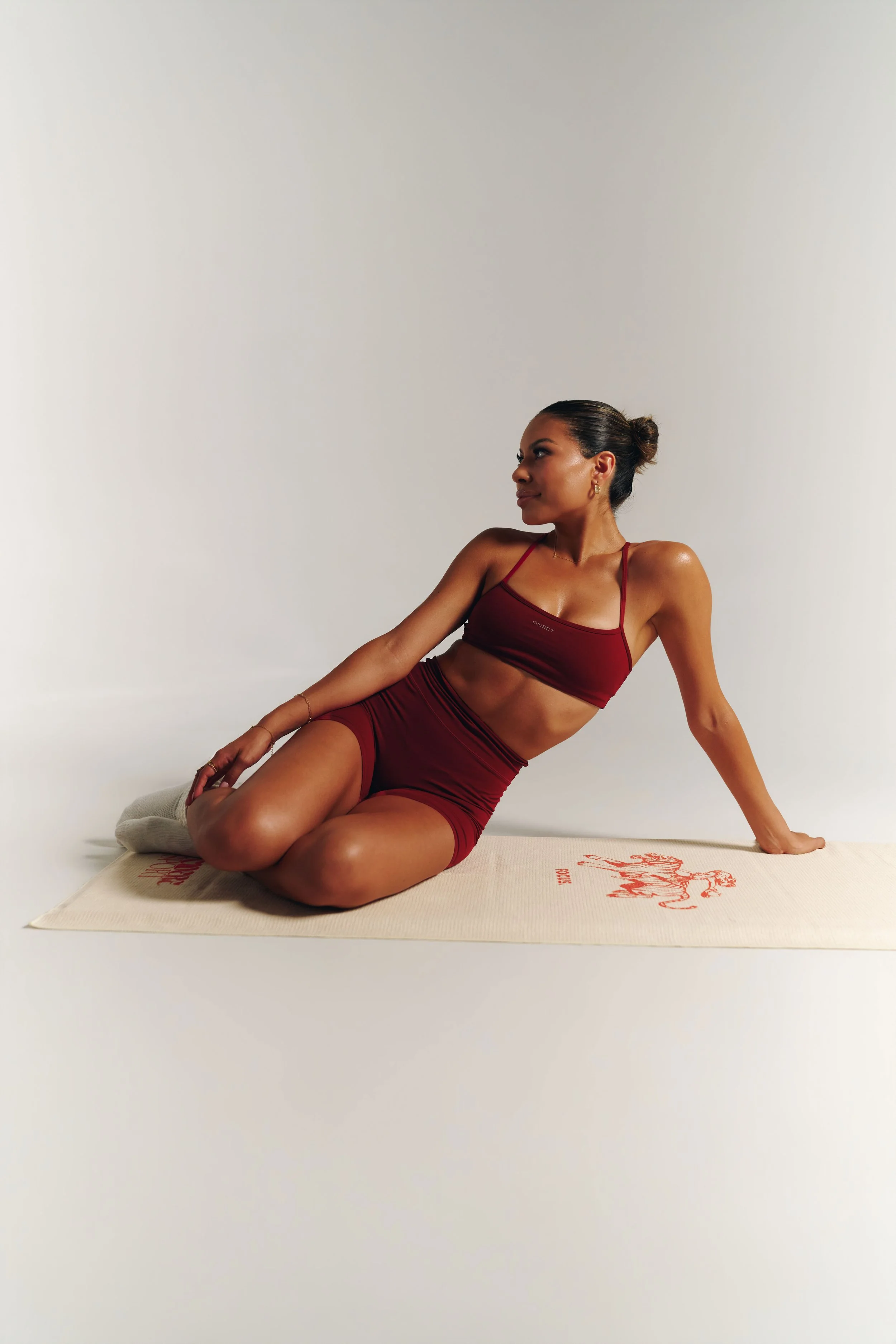 james-davis-commercial-photography-decidere-sport-burgundy-set-seated-cream-focus-mat.jpg