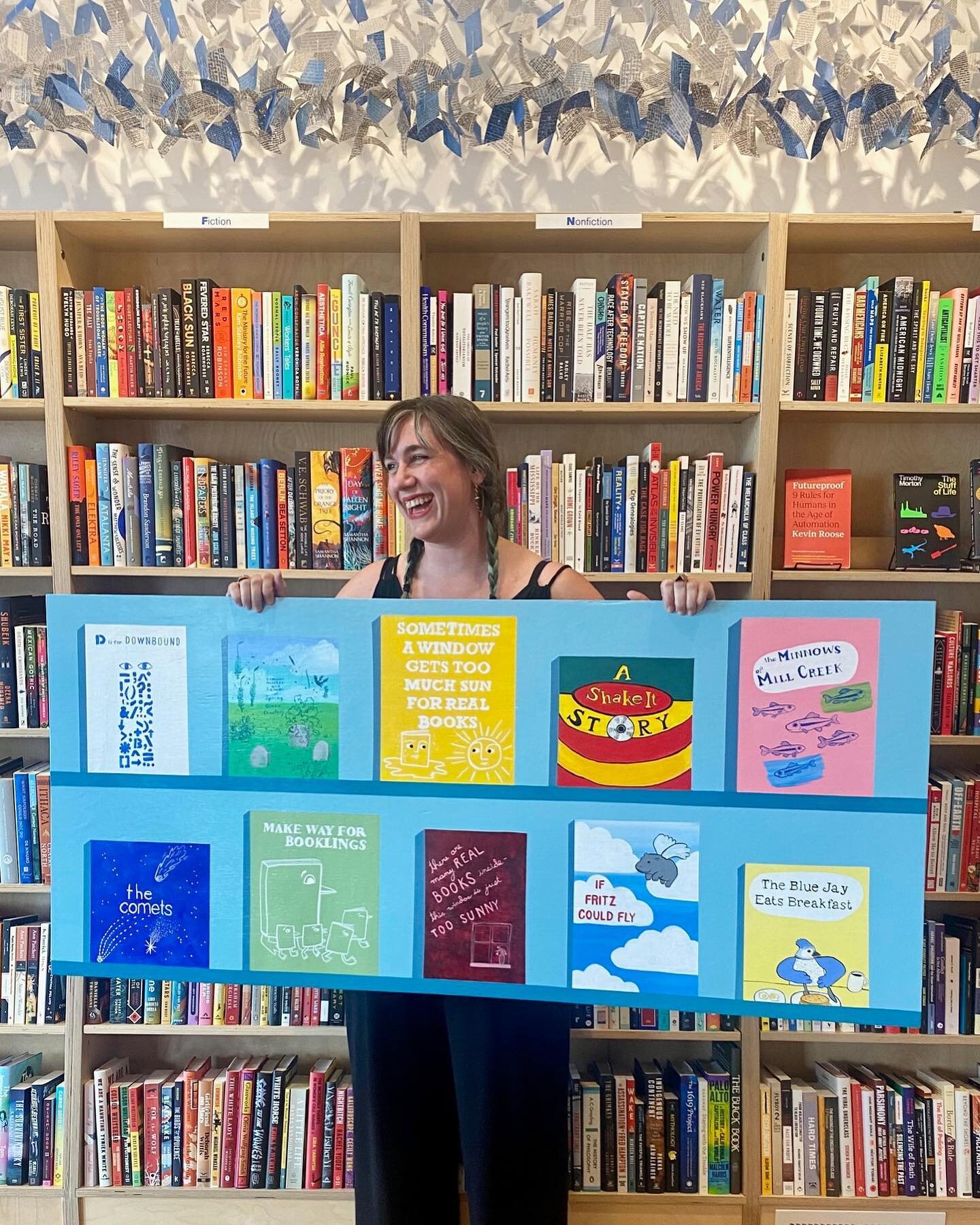 If a bookstore window display gets too much sun and it&rsquo;s damaging the books, then clearly the ONLY solution is painting a panel with fake books, puns, and (very) thinly veiled references to Northside locations. Thank you @downboundbooks for thi