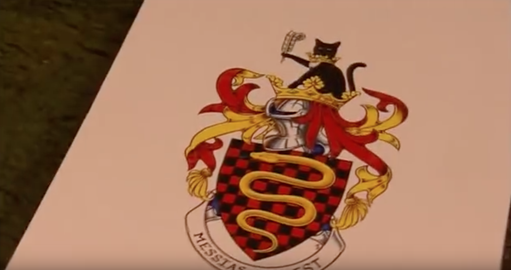 Terry Jones’ custom coat of arms includes a golden python (naturally), his cat holding a feather pen (to symbolize his writing career), and a Life of Brian reference in the latin phrase “Messias non est.” From Terry Jones’ Medieval Lives: The Knights.