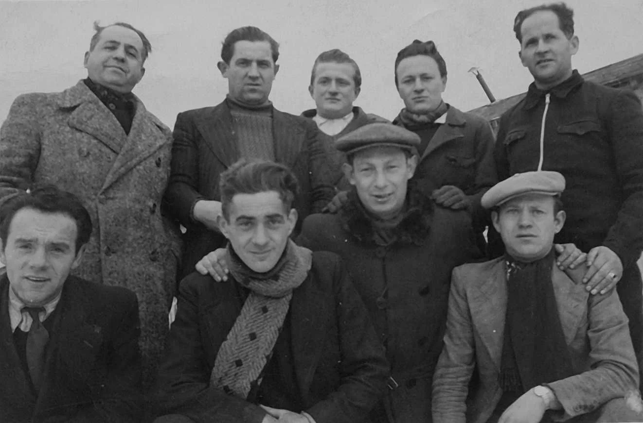 Leon Kneeling with others.jpg