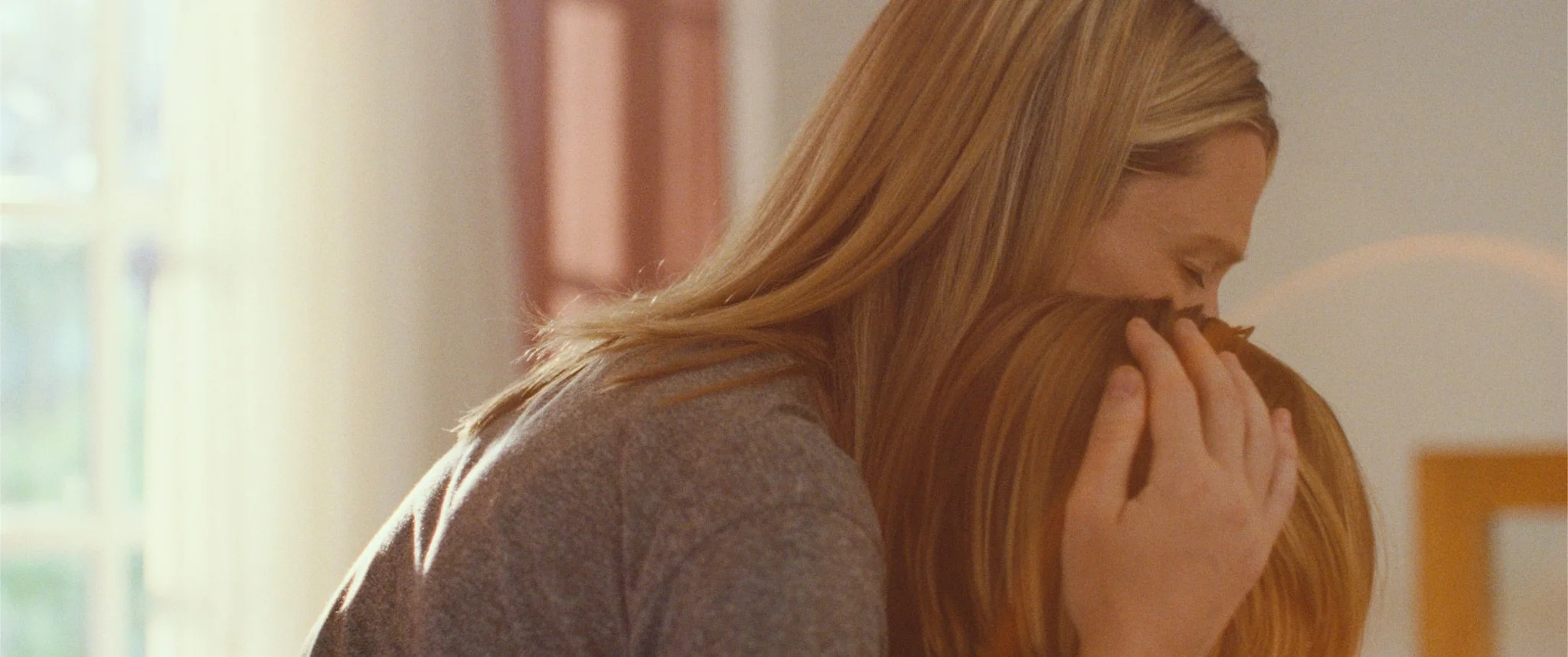 AEACYE_FilmStill4_LilaHug.jpeg