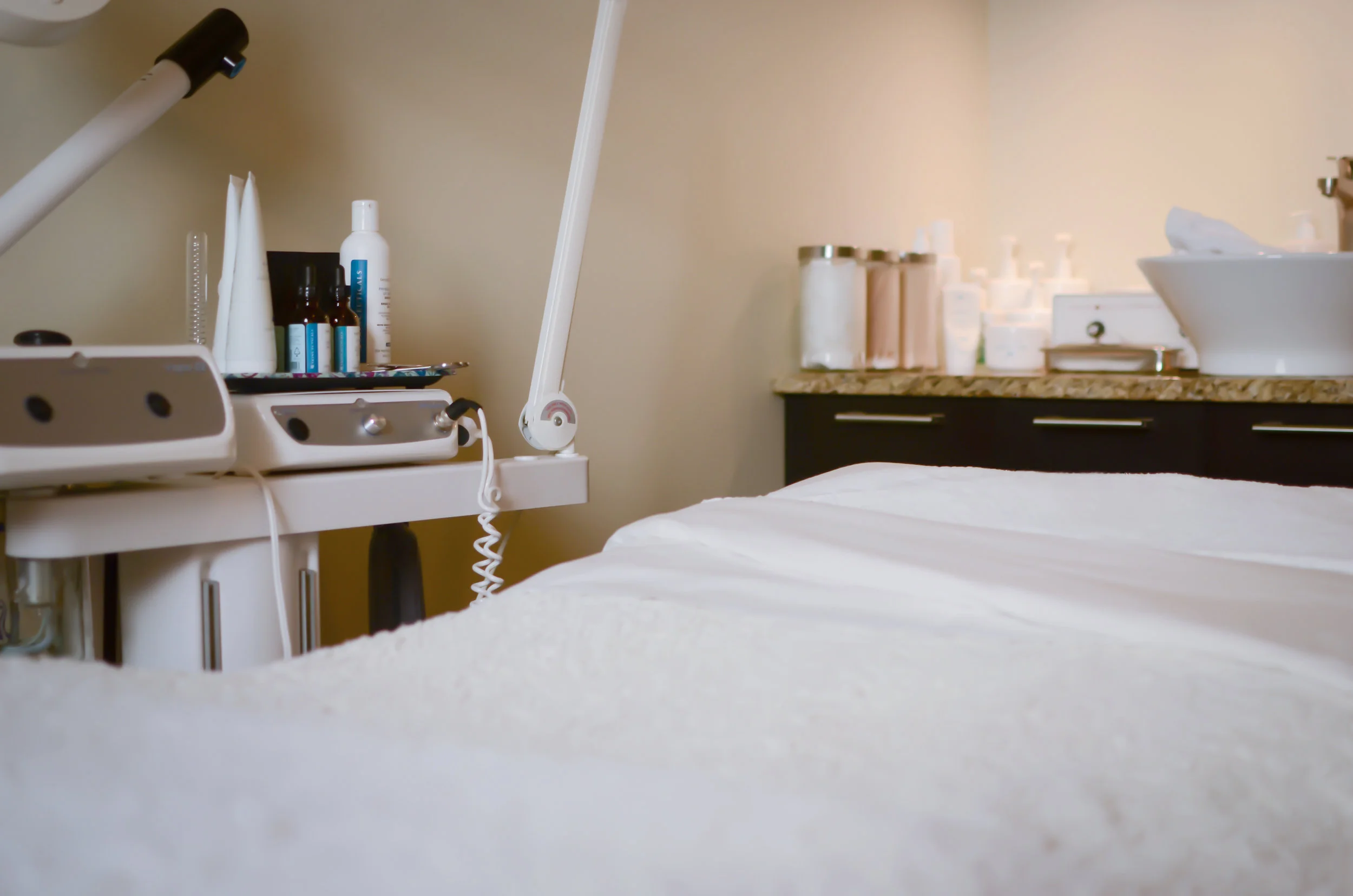 Clean, professional medical spa treatment room with neutral tones at Kimber Esthetics in Minneapolis