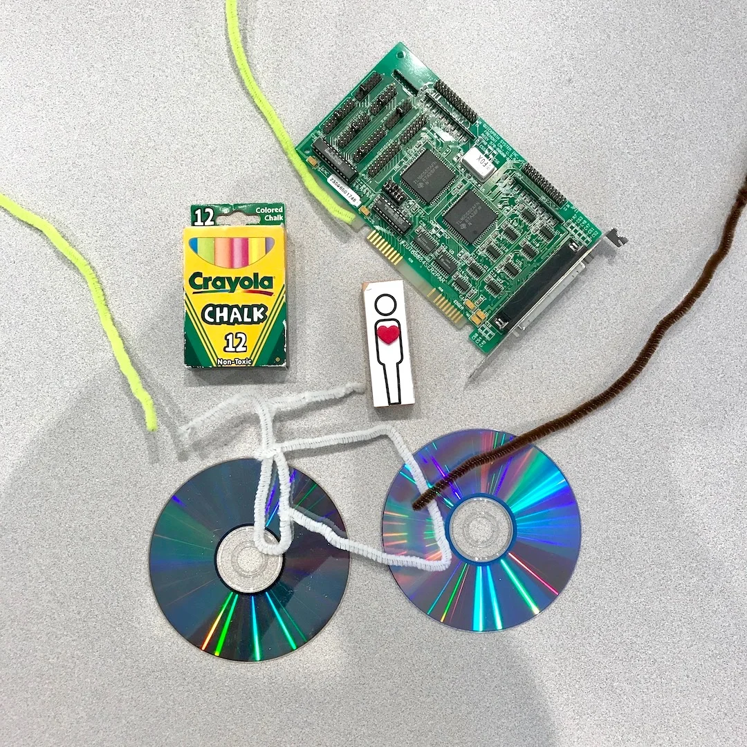 I chose to represent myself with attributes of Portland’s bicycle culture, my love of Laserdisc movies, my career in electronics, and my fine arts education.