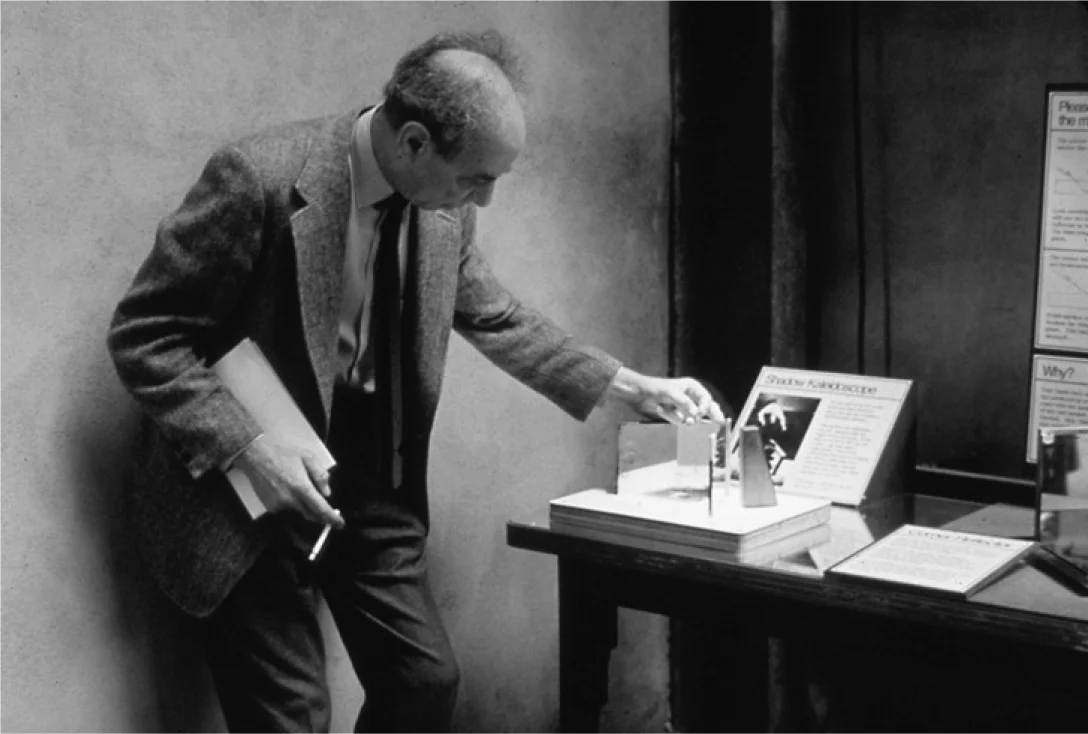 Frank Oppenheimer playing with Shadow Kaleidoscope. And smoking. Ah, the old days . . .&nbsp;