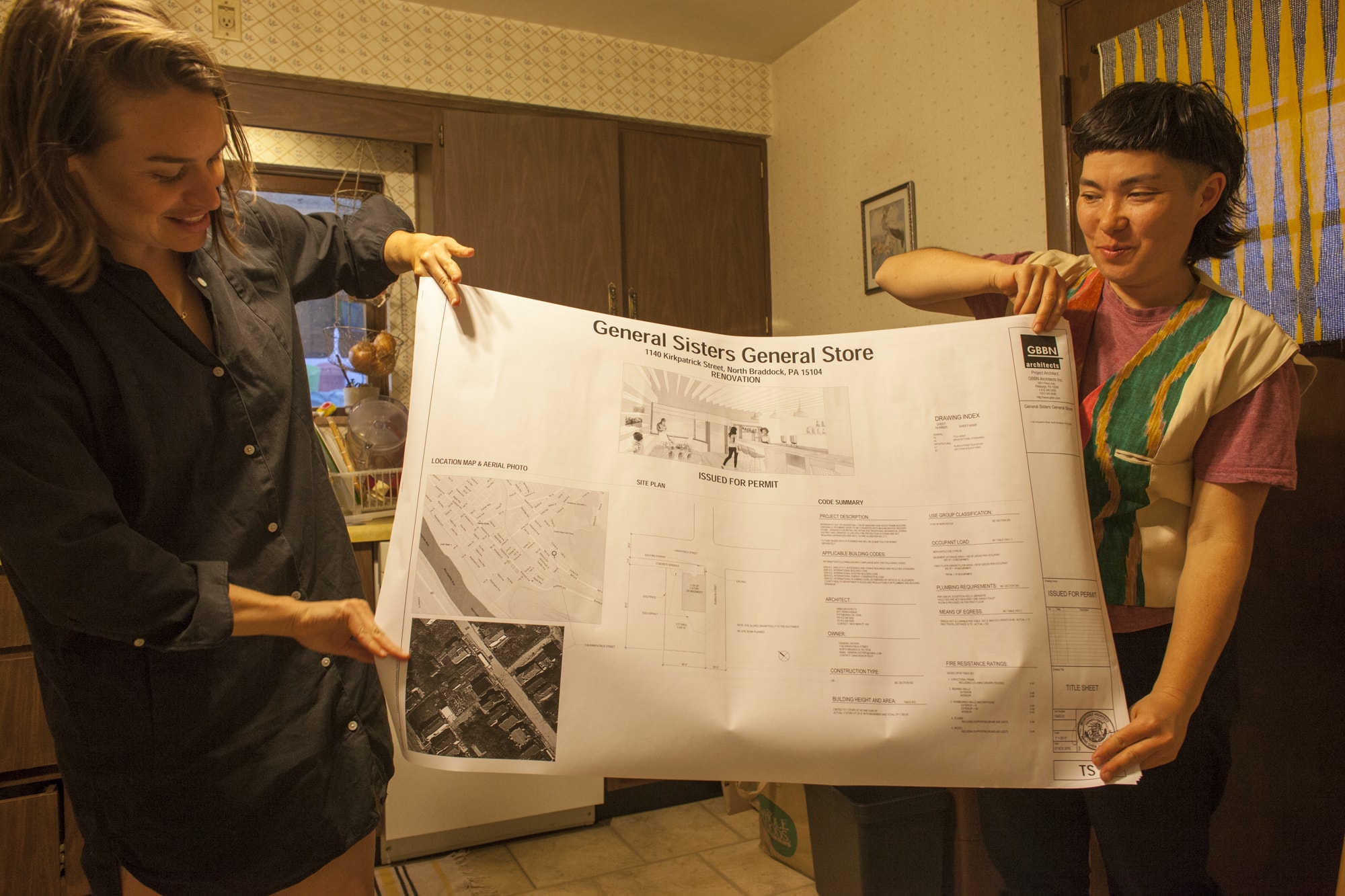 Dana Bishop-Root and Ginger Brooks Takahashi holding up the plan for General Sisters General Store, 10 April 2017. Photo by Colter Harper