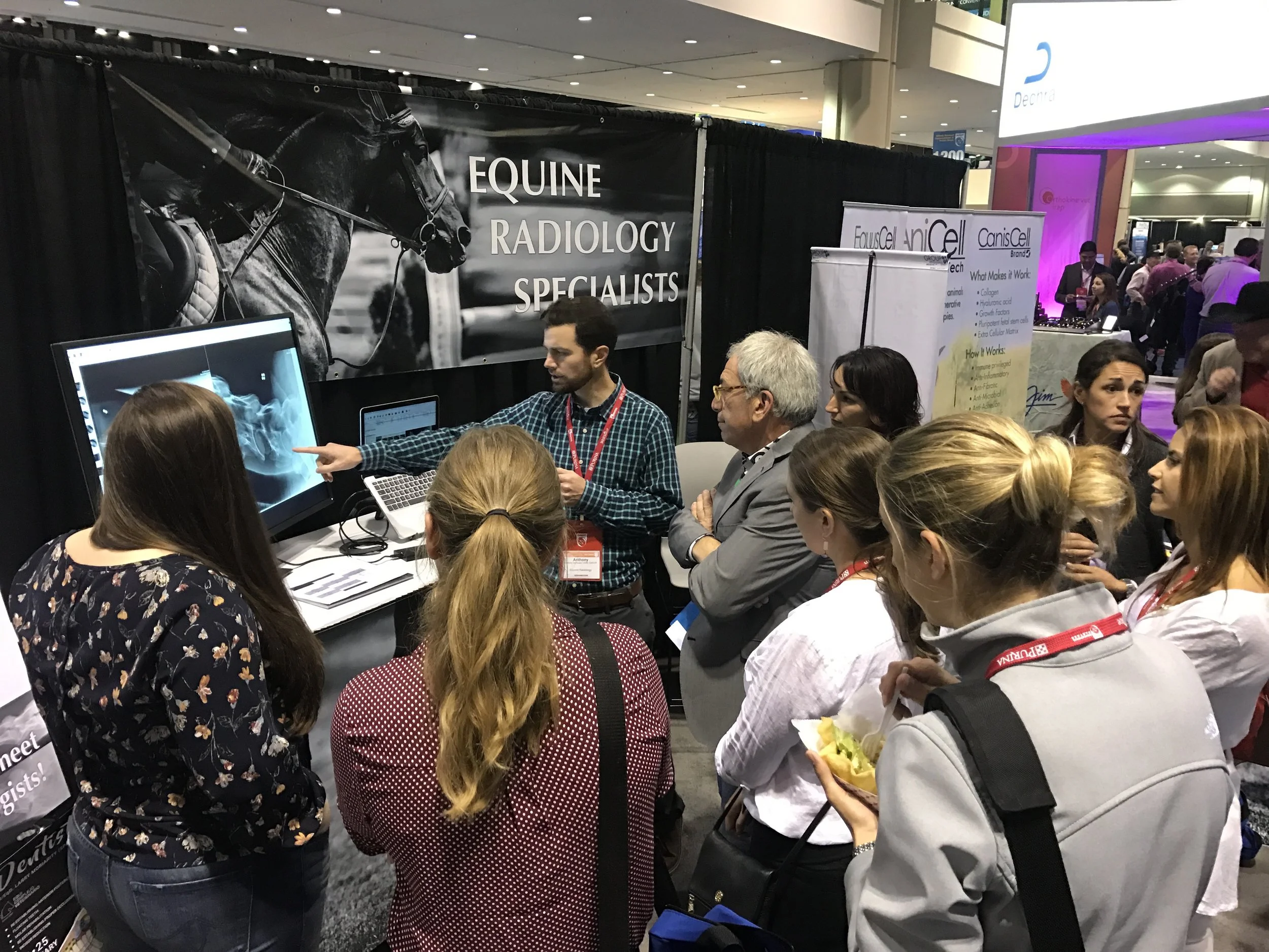 Anthony DeRouen leading radiology rounds at AAEP.