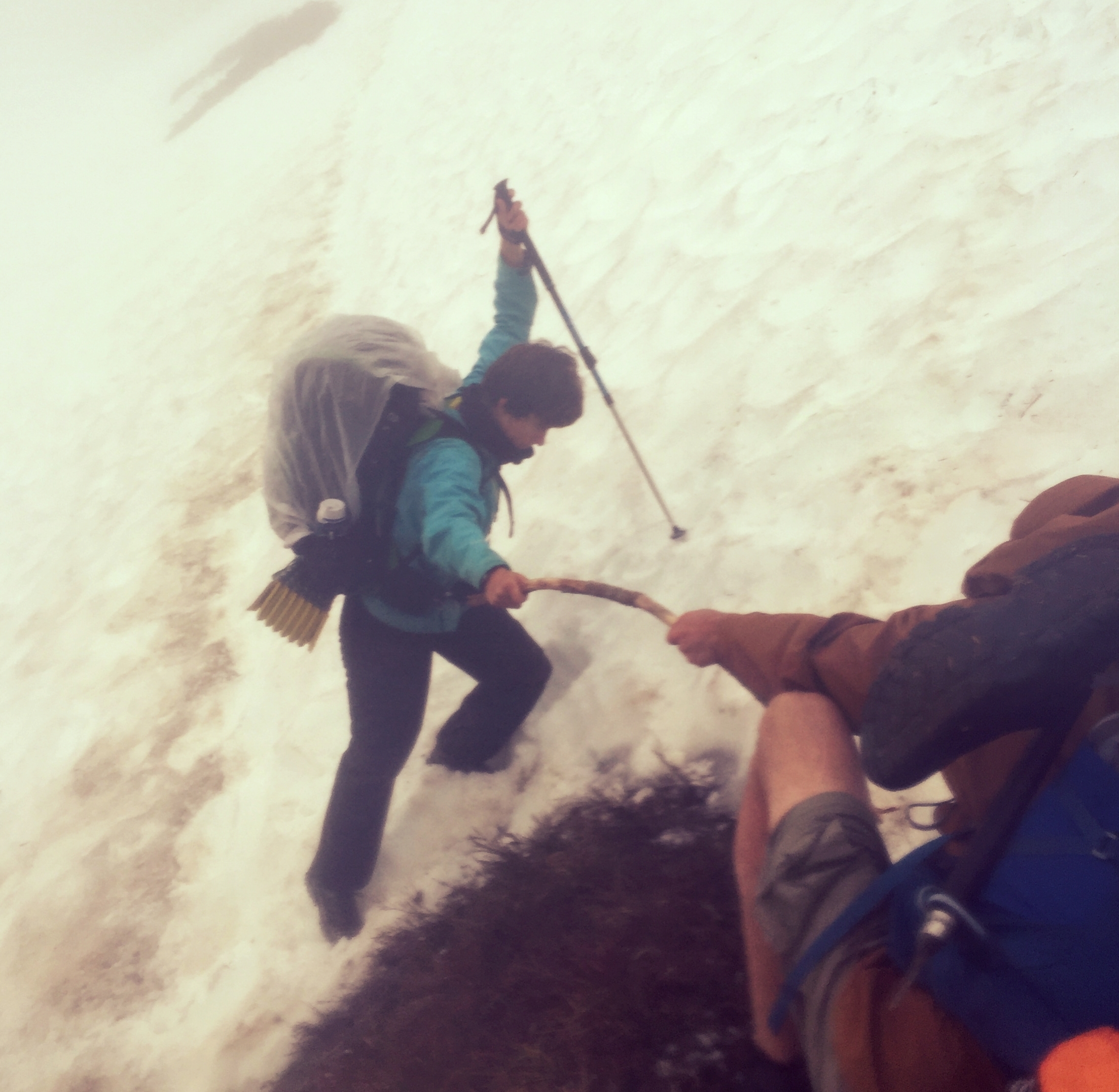 A SOBO hiker attempts to cross a steep section of snow between Red and White Pass