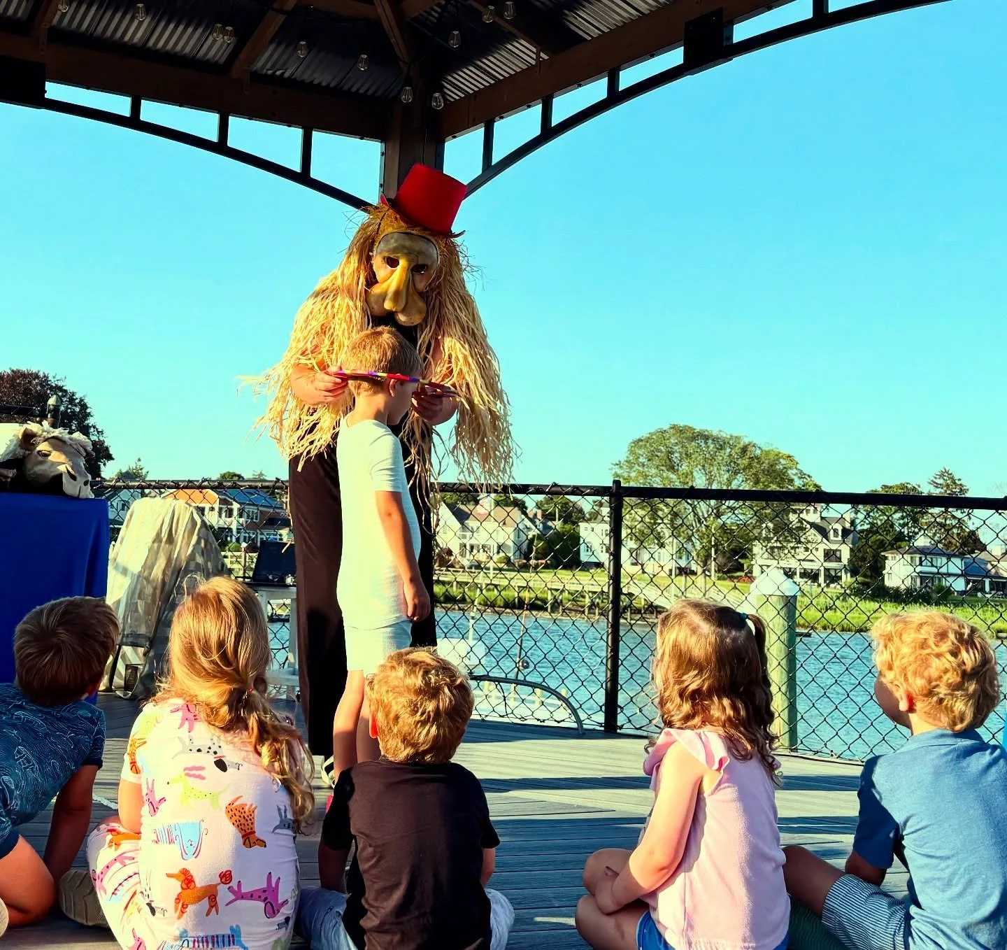 We had a special evening event at the Milford Yacht Club this week for families there with puppets, mask-making and a dance party!  The children were so interested and curious that they crawled up onstage for some audience participation parts of the 