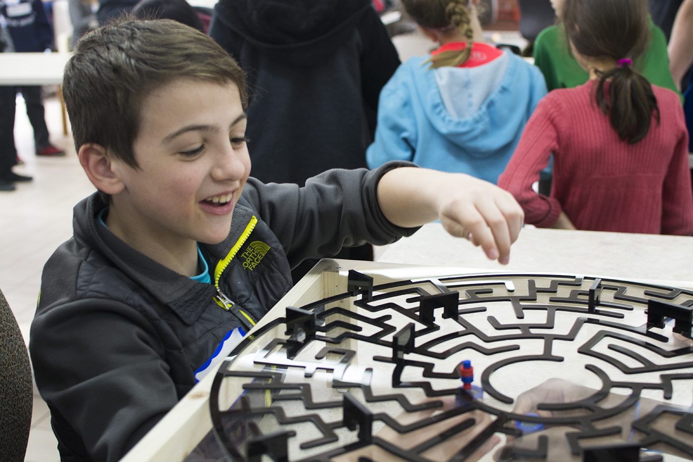 An open top tempted kids to use there hands to move the pieces when they got frustrated