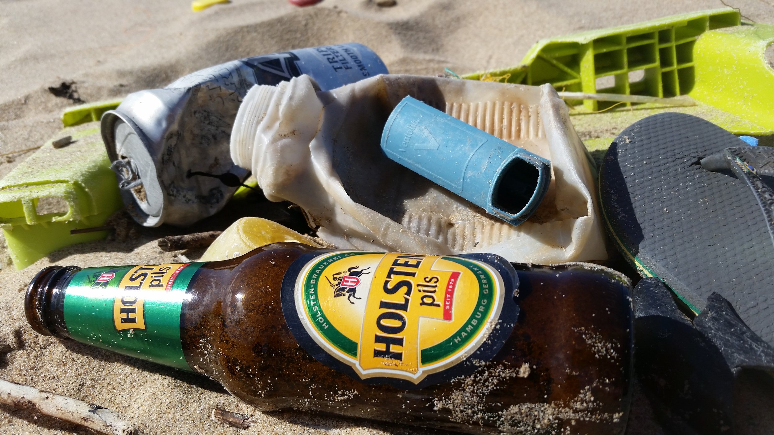 Beer bottle and Asthma inhaler amongst the litter we found.