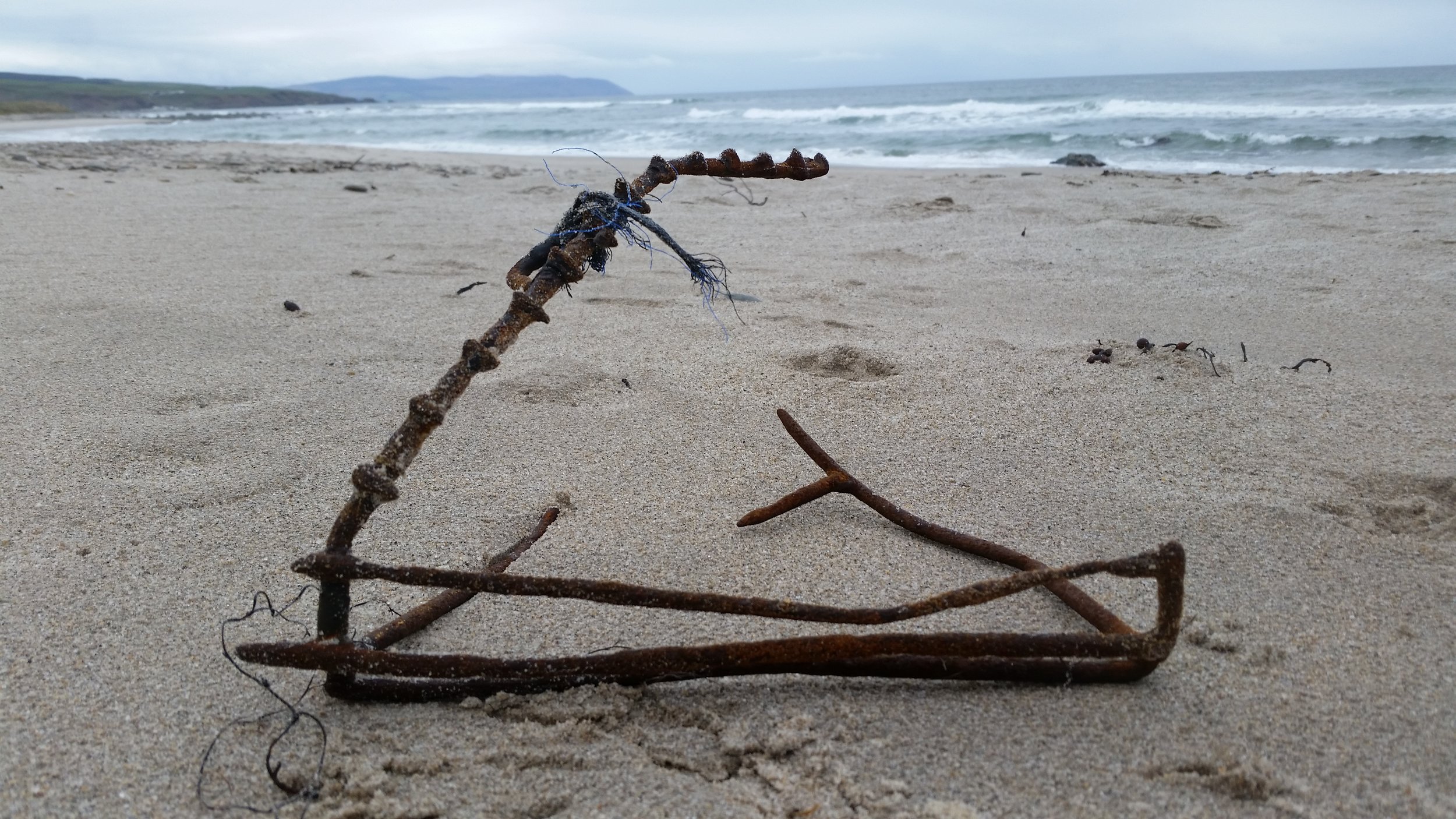 This nasty piece of kit we found half buried, it looks more like a bear trap than a lobster trap!