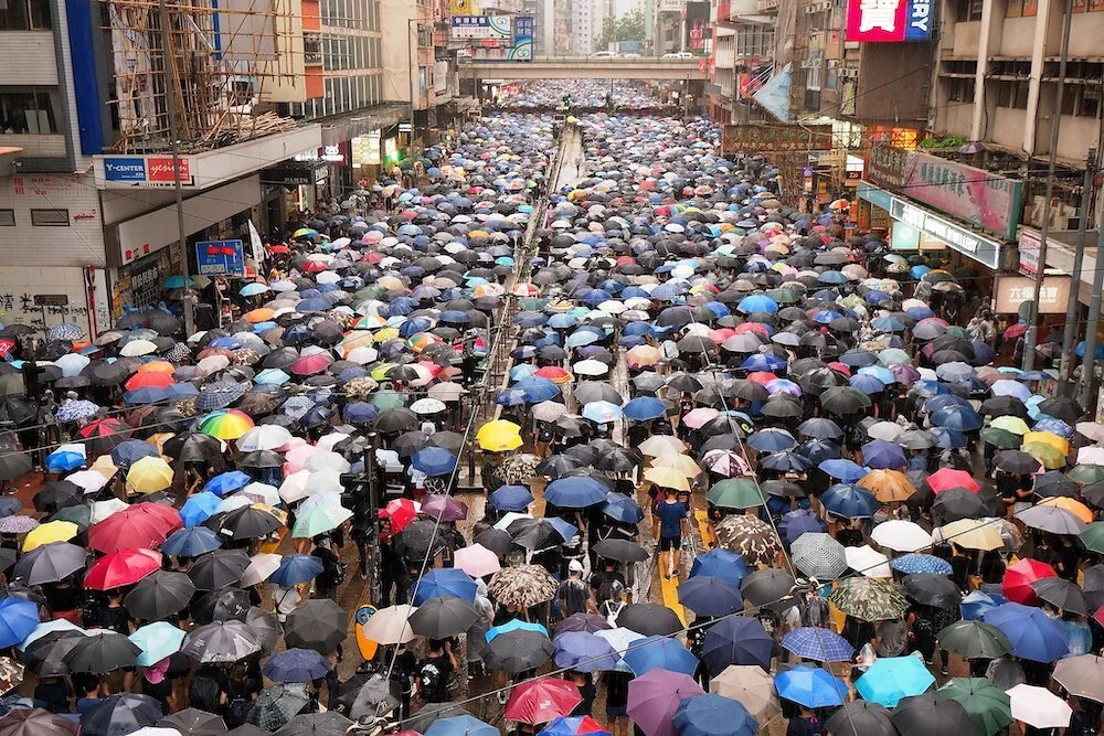 Protestors in Hong Kong gather against emergency anti-mask legislation, passed in response to months of demonstrations. Photo: Etan Liam/Flickr (CC BY-ND 2.0).