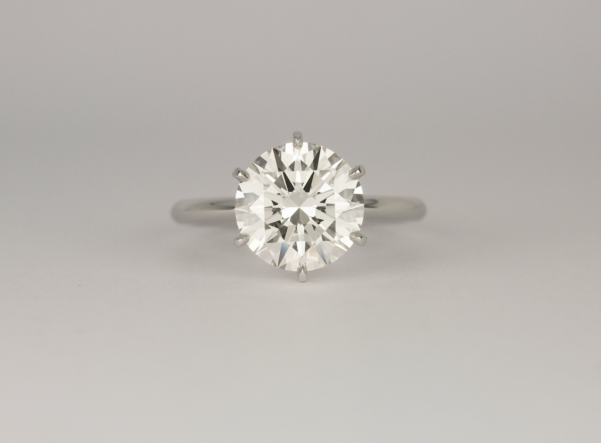  Six claw solitaire round brilliant cut platinum engagement ring 