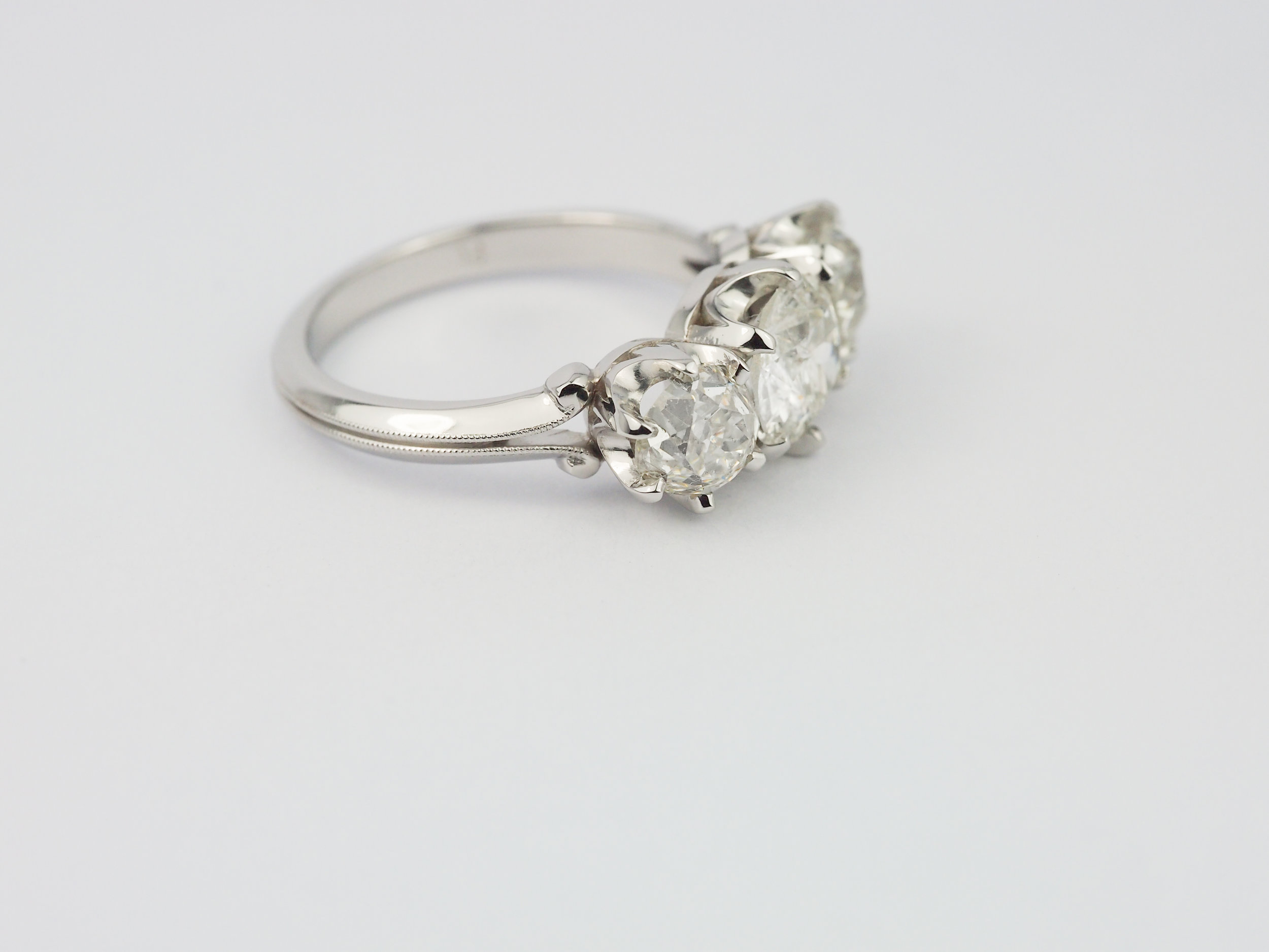  Old cut diamond three stone platinum engagement ring 