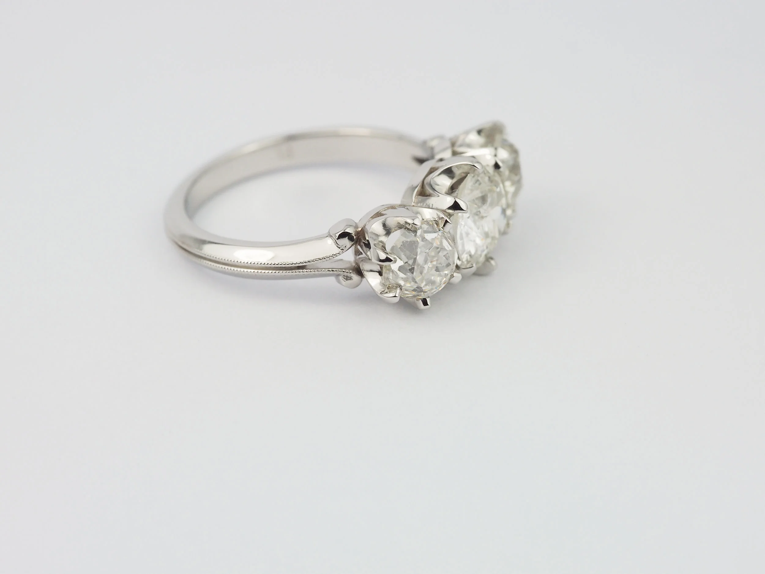 Old cut diamond three stone platinum engagement ring