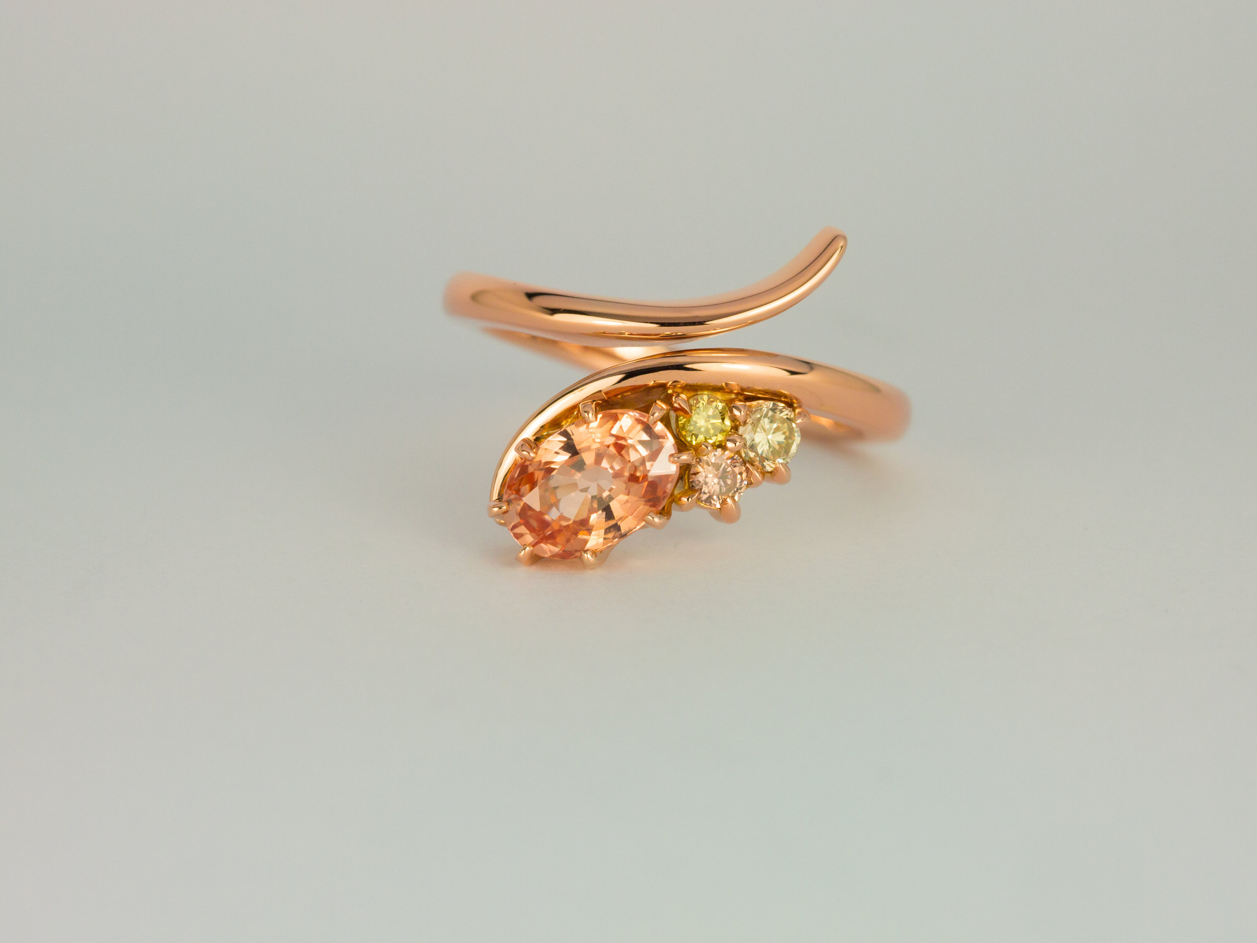  Padparadscha sapphire and coloured diamond rose gold engagement ring 