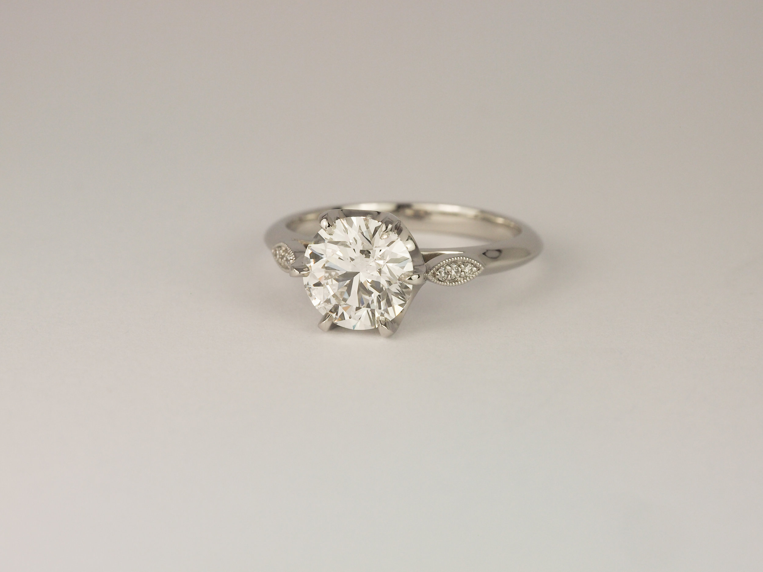  Platinum diamond engagement ring with millegrain detail  