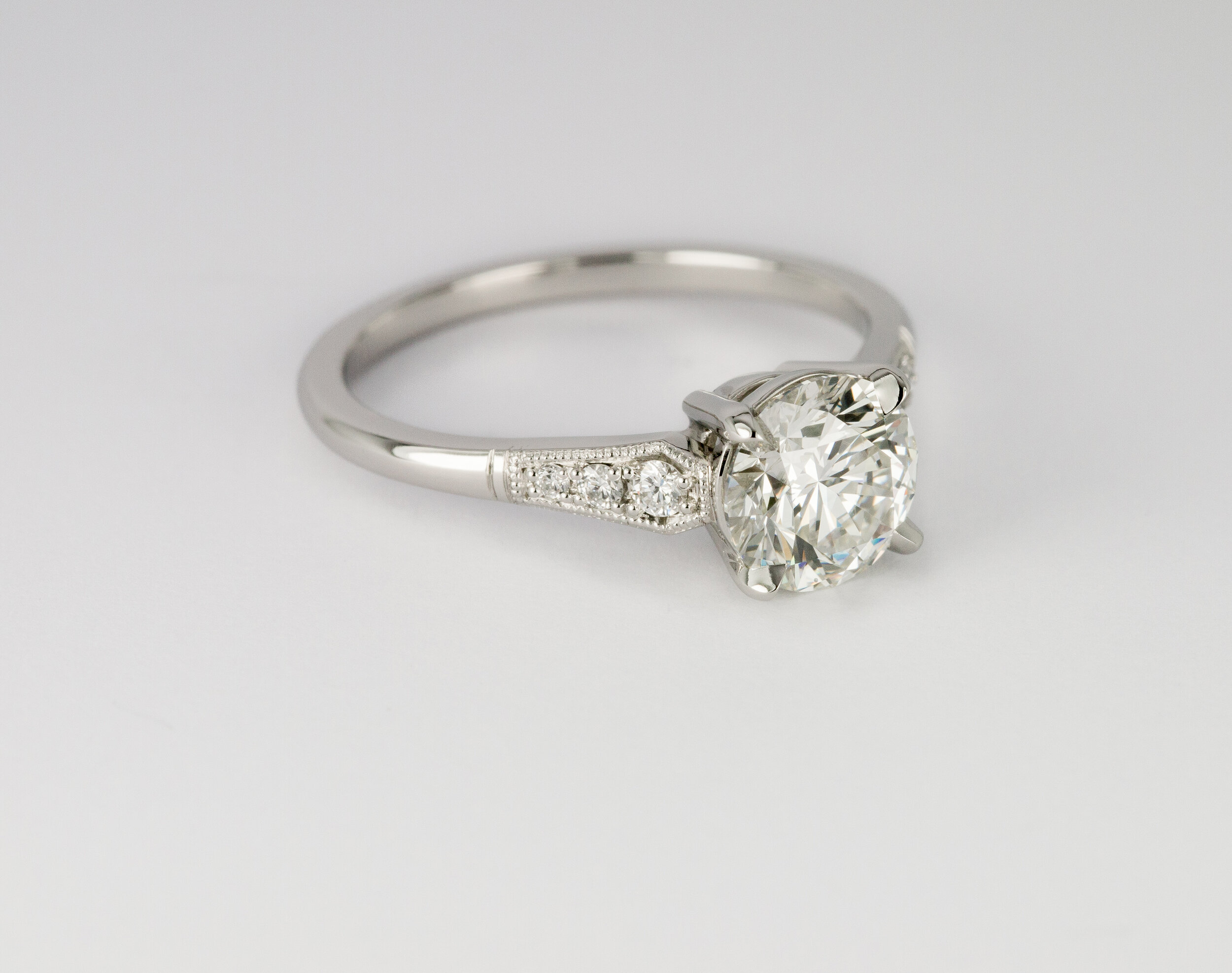  Platinum diamond engagement ring with millegrain detail  