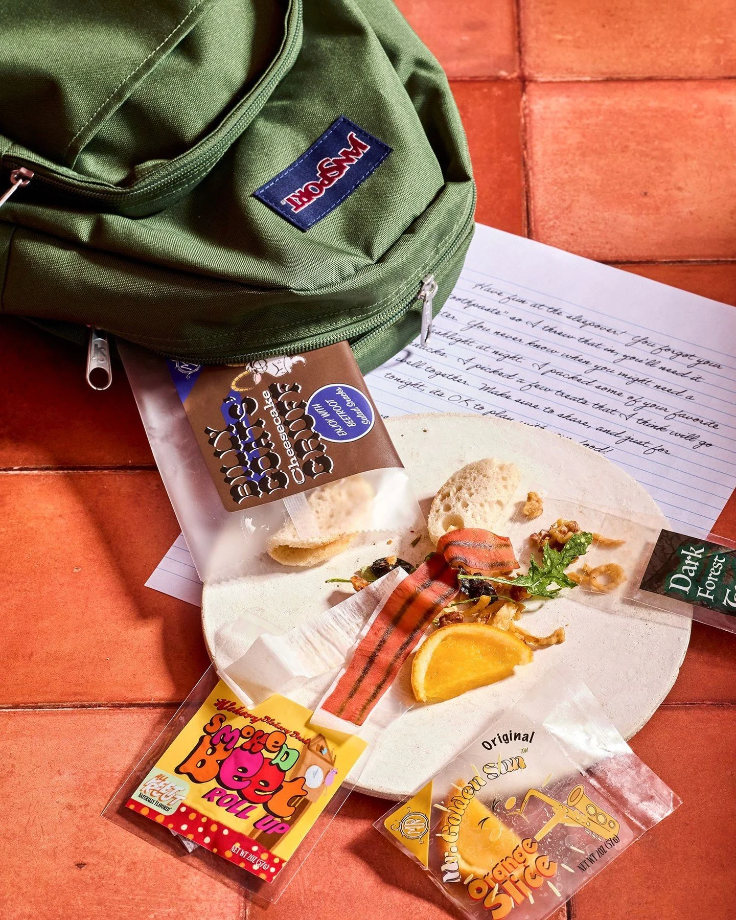 Don't worry, Mom packed snacks. Our take on your sleepover snack bag includes a few nods to the nostalgic favorites we all know and love, with an elevated update. We really had fun with this one. Everything, including the packaging, is conceptualized