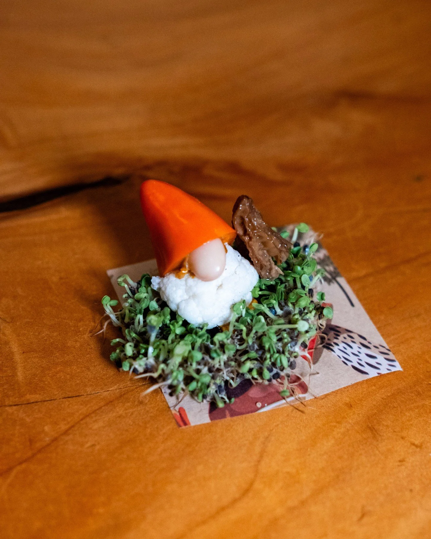 Look closely when you take your seat, for you'll find a tiny, adorable, and edible gnome hiding among the moss woods.	

#merchantroots #feastofomosswoods #gnome #edibleart #cheflife
