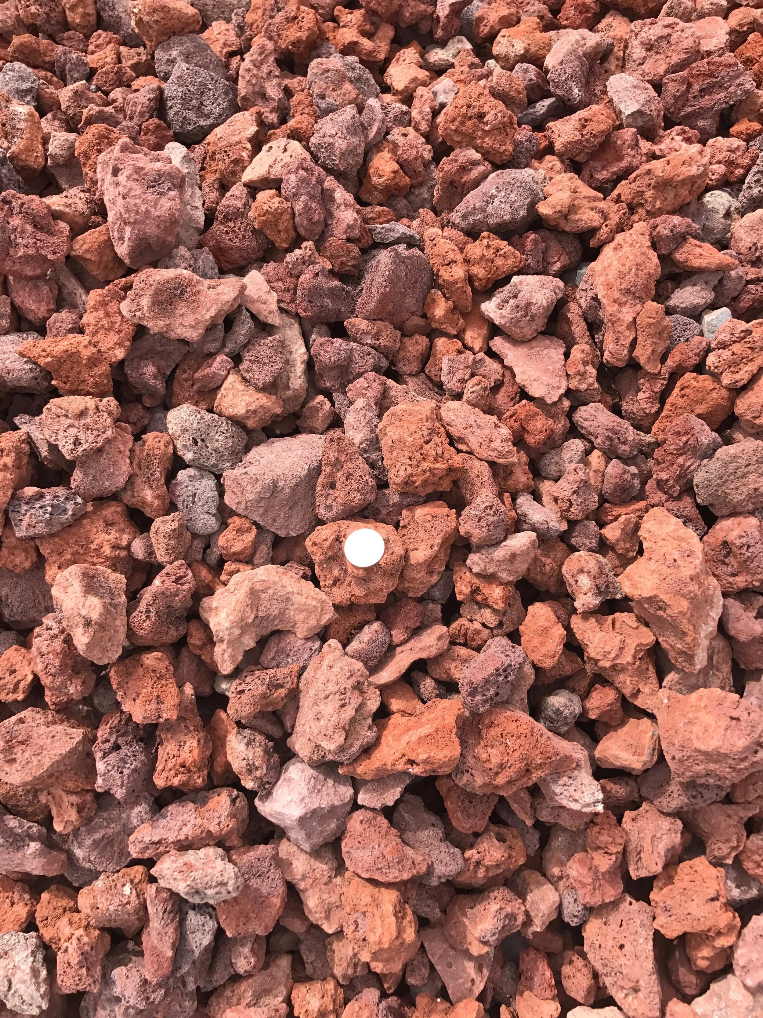 Scoria 1 1/2" Red pumice rock used for landscaping