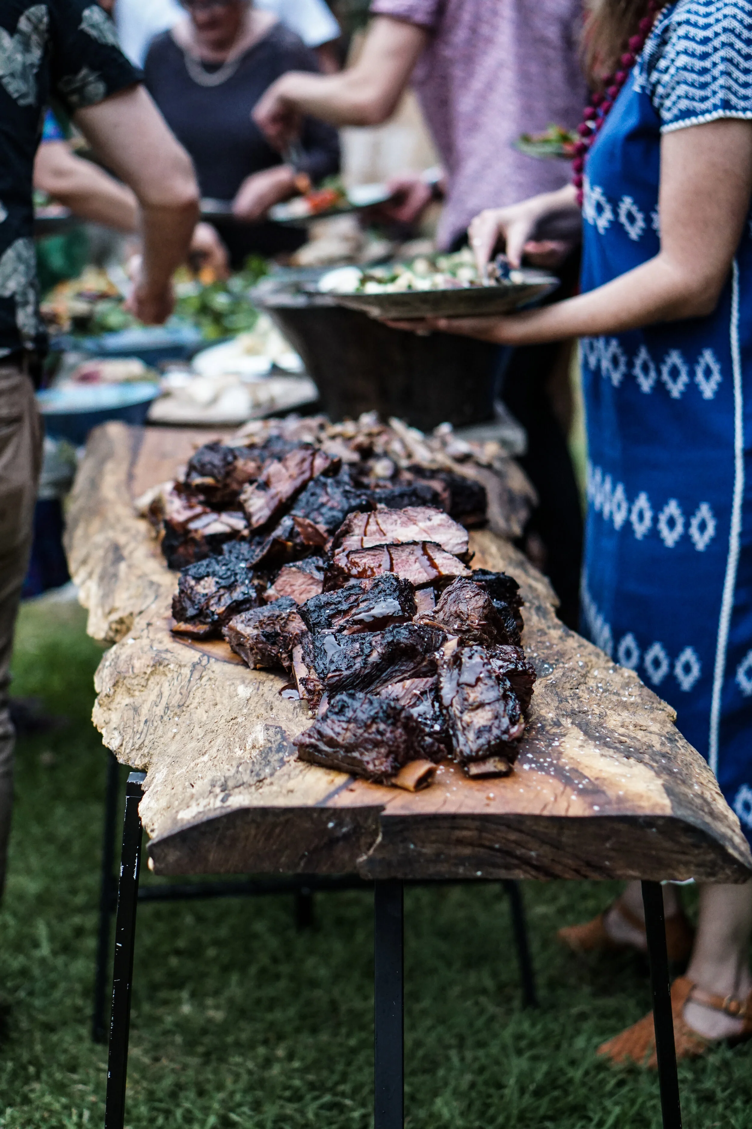grilled-meat-laid-on-a-wood-slab-3276235.jpg